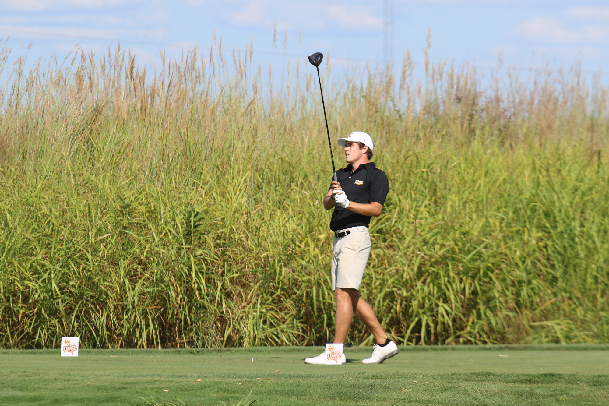Campbell Cox watches his tee shot off teeing off on the first hole at Gateway National