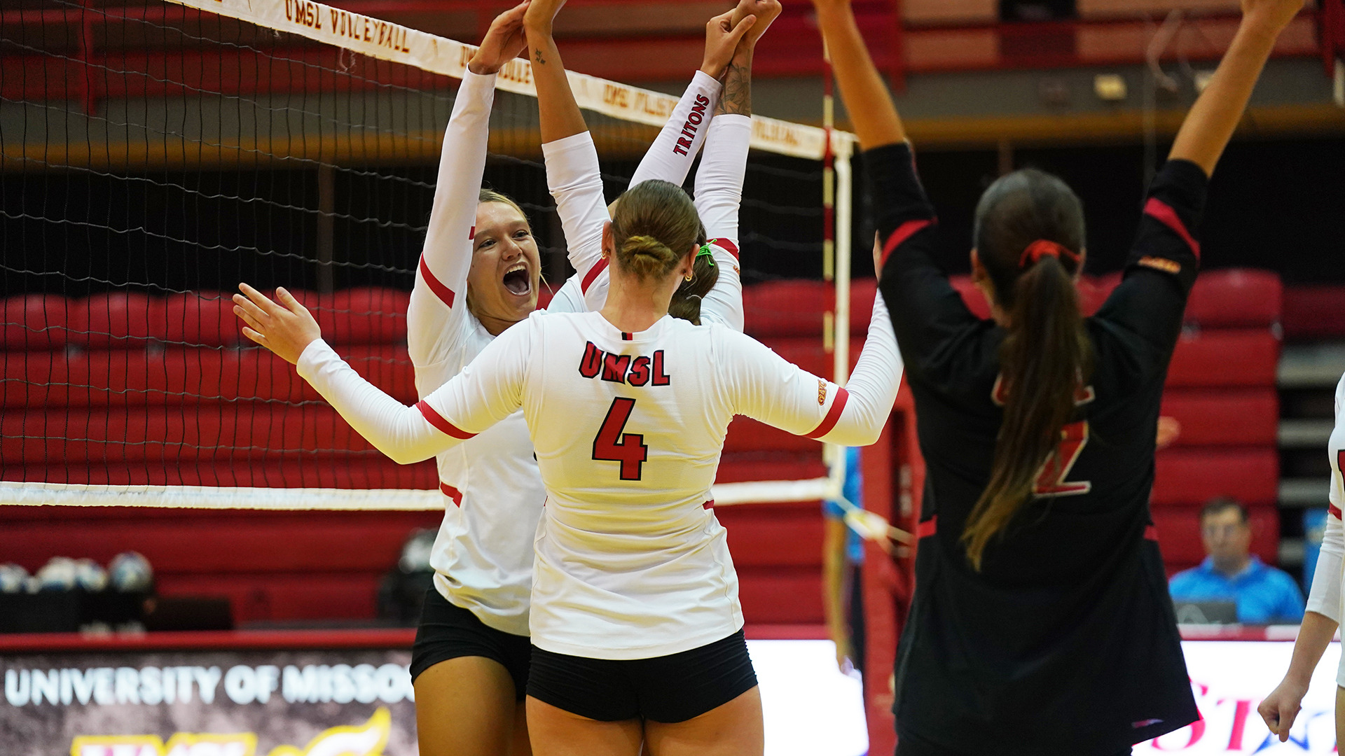 UMSL Volleyball players Maggie Johnson, Brooklyn Young, Marly Burbach and Skylar Weaver celebrate after scoring a point in its match against Southwest Baptist