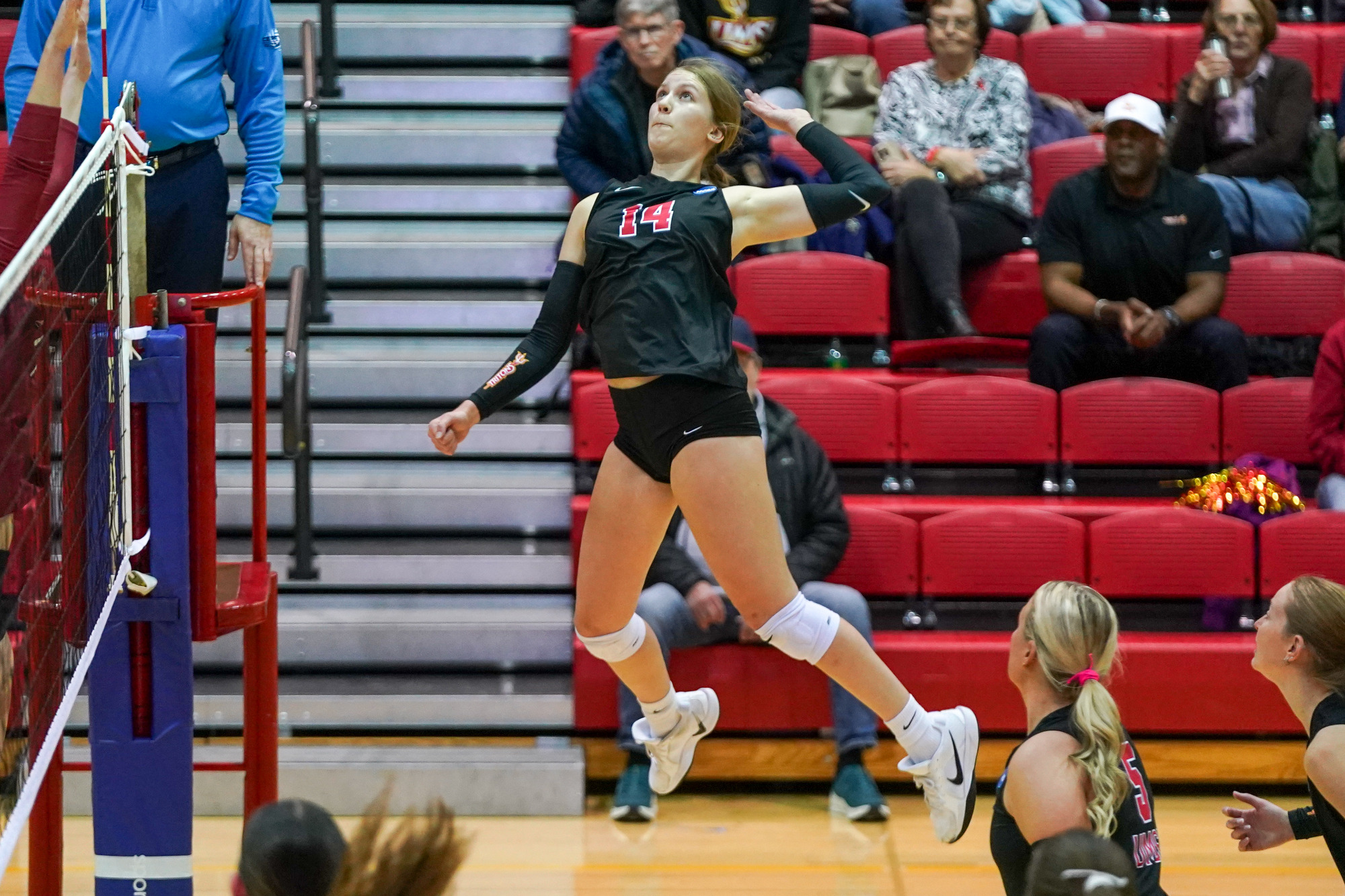Alayna Santel goes up for an attack in an NCAA Volleyball Regional contest against the University of Indianapolis