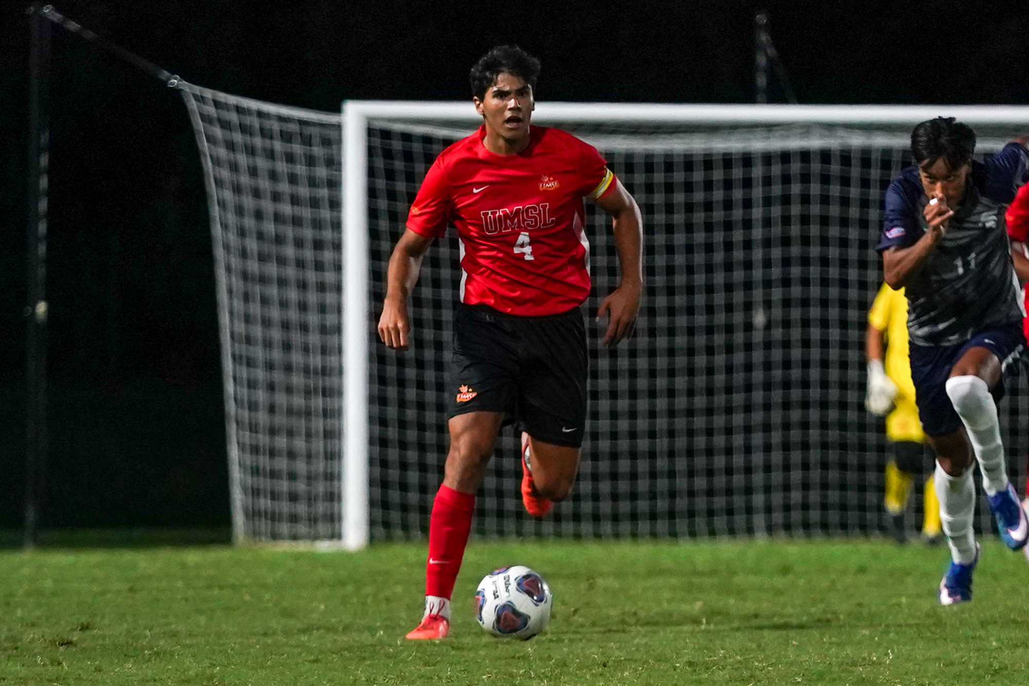 Mario Garcia dribbles the soccer ball down field in a match against Missouri Baptist