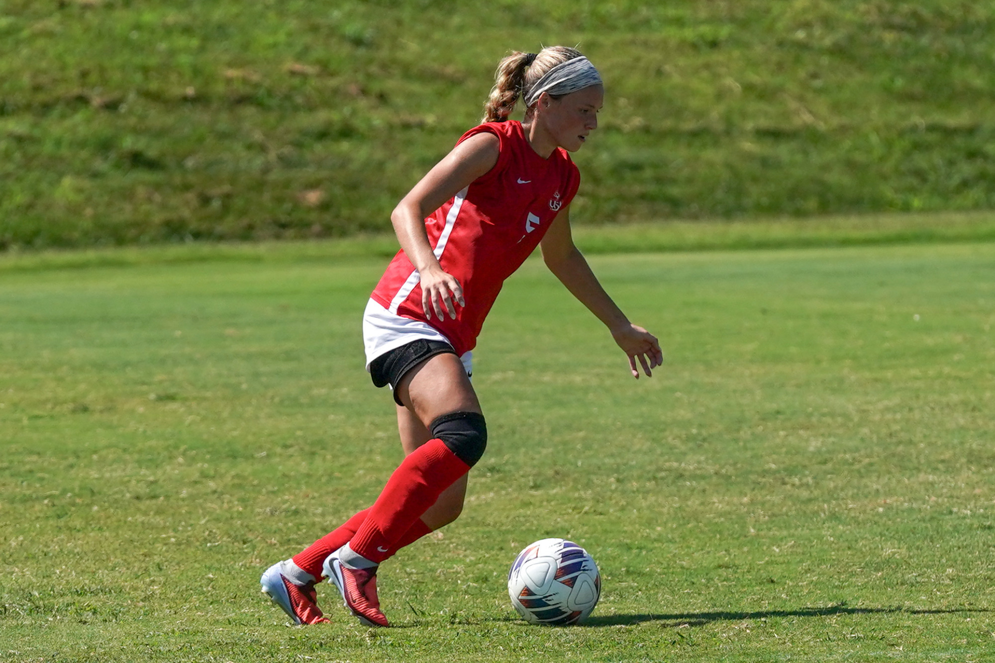 Josie Maddox looks to make a play on the soccer ball in an NCAA Division II women's soccer match against Parkside