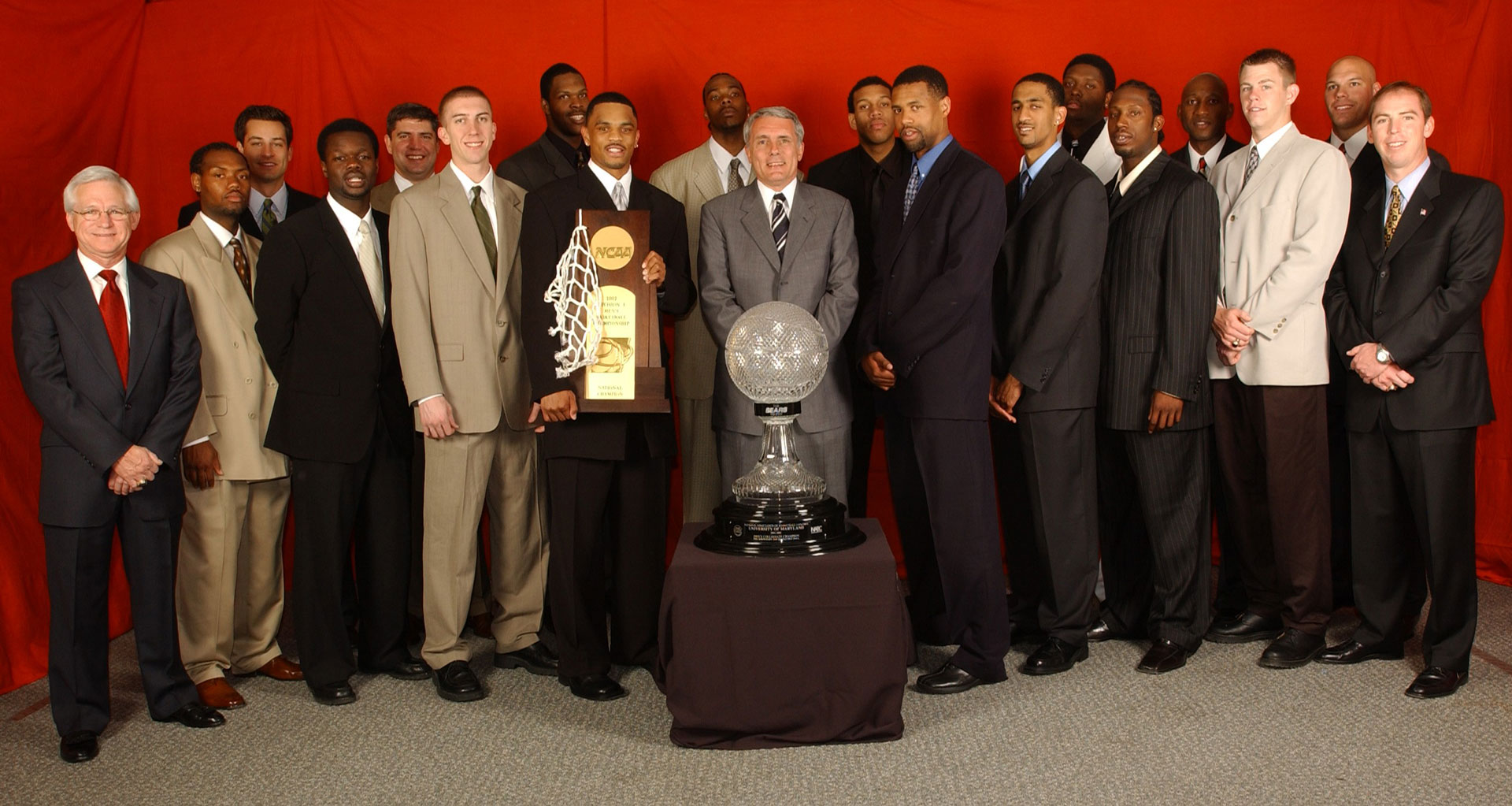2002 Maryland men's basketball team posed with trophies