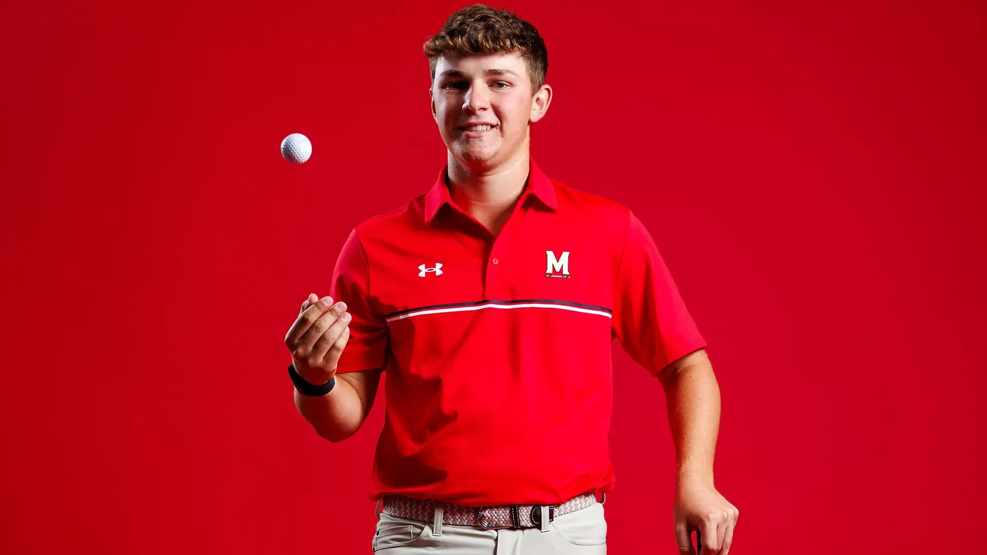 Griffin Barke posed red background 