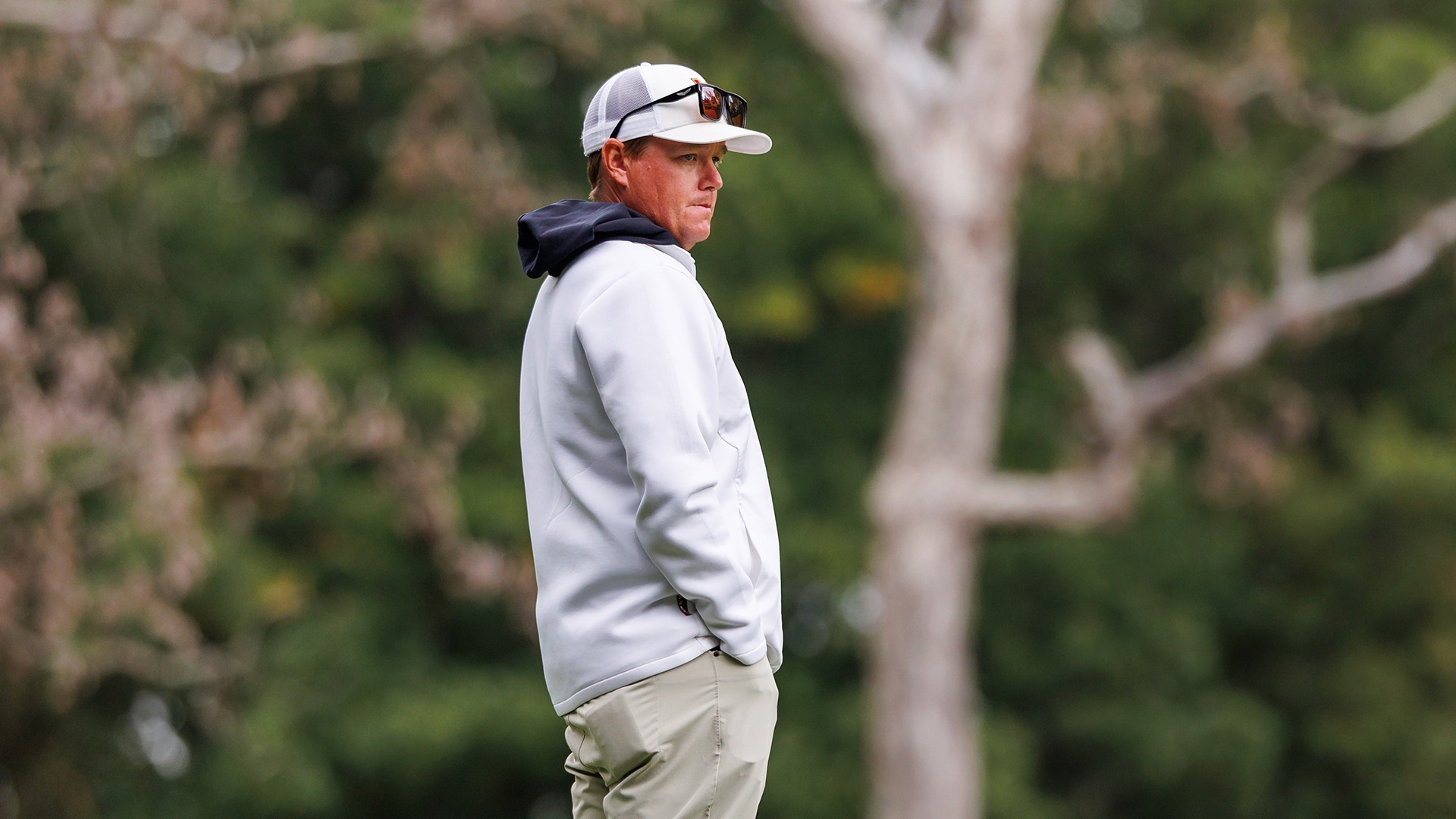 John Phillips watches golf practice