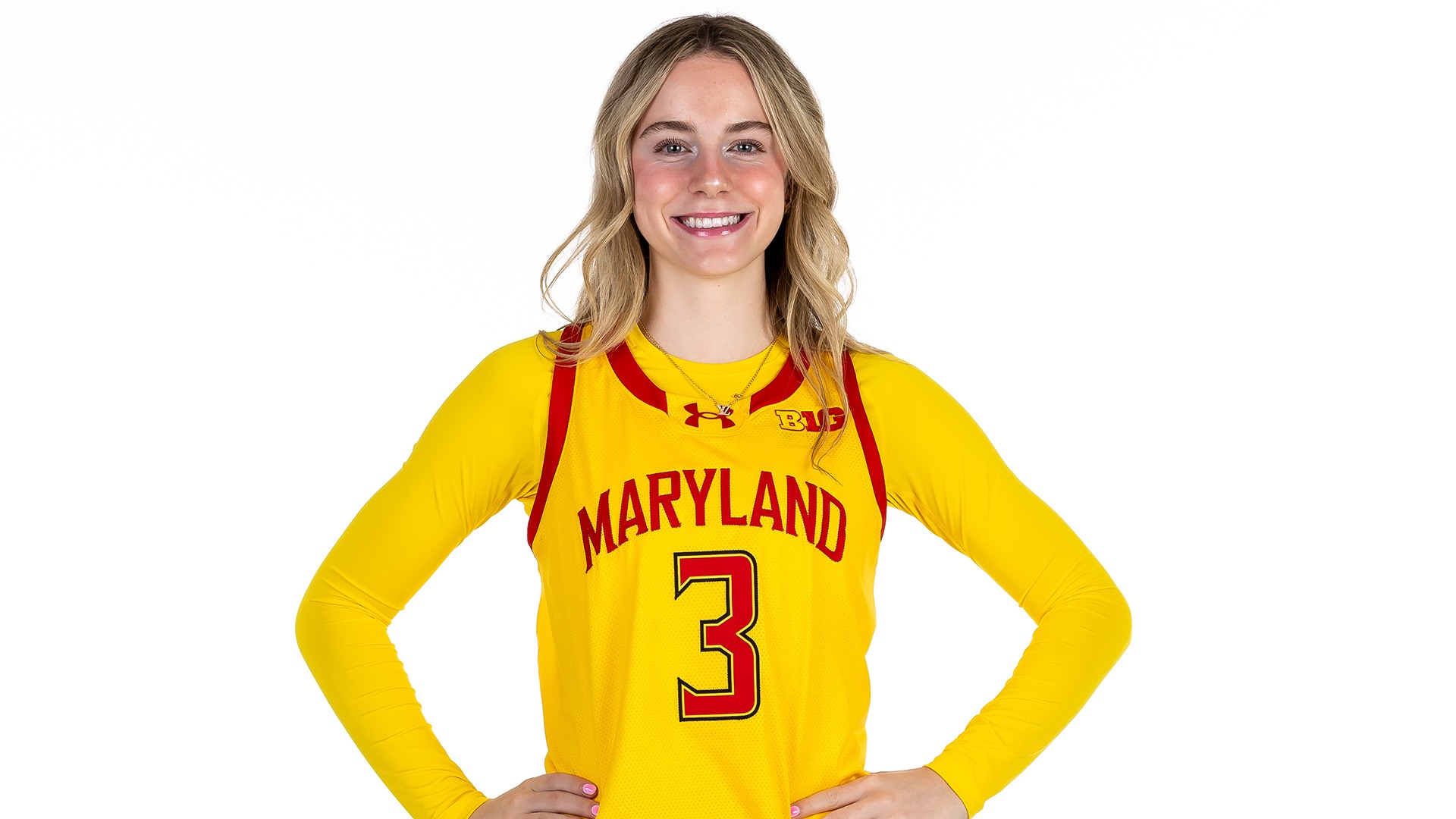 Addi Mack posed gold uniform