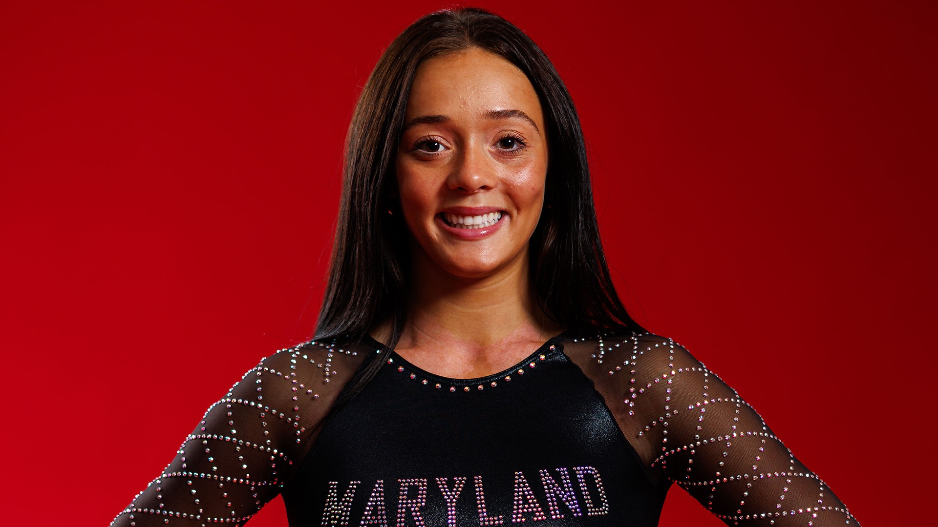 Chelsey Dennis Posed Red Background