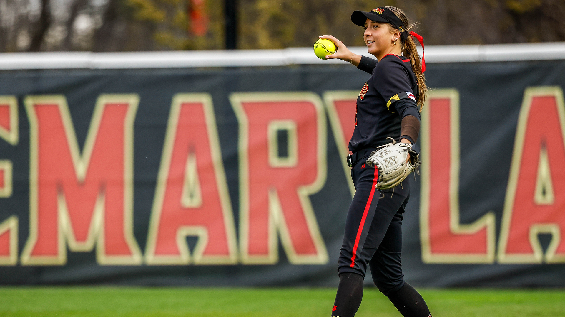 Bailey Murphy throwing a softball