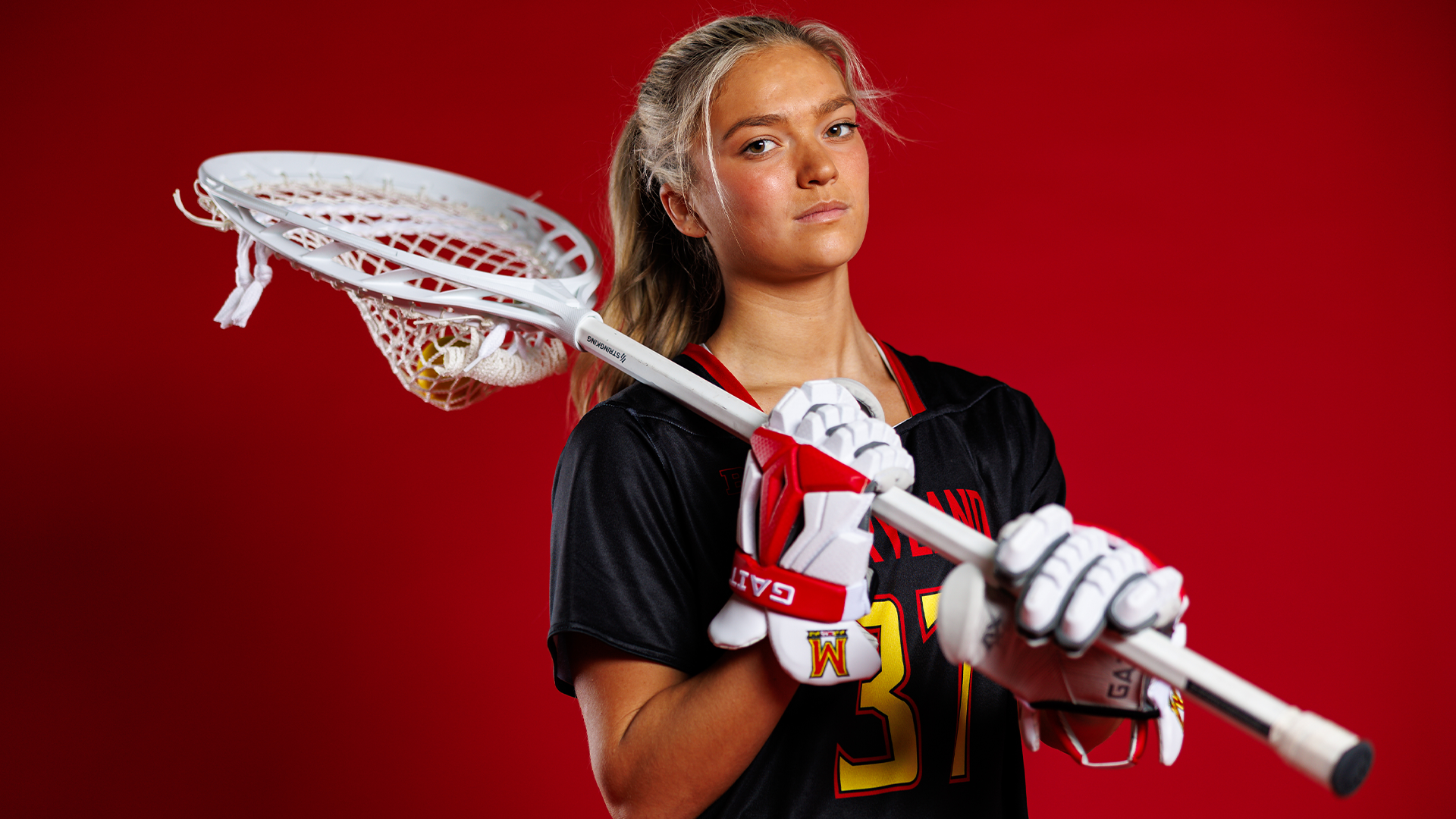 Carly Peterson red backdrop posed