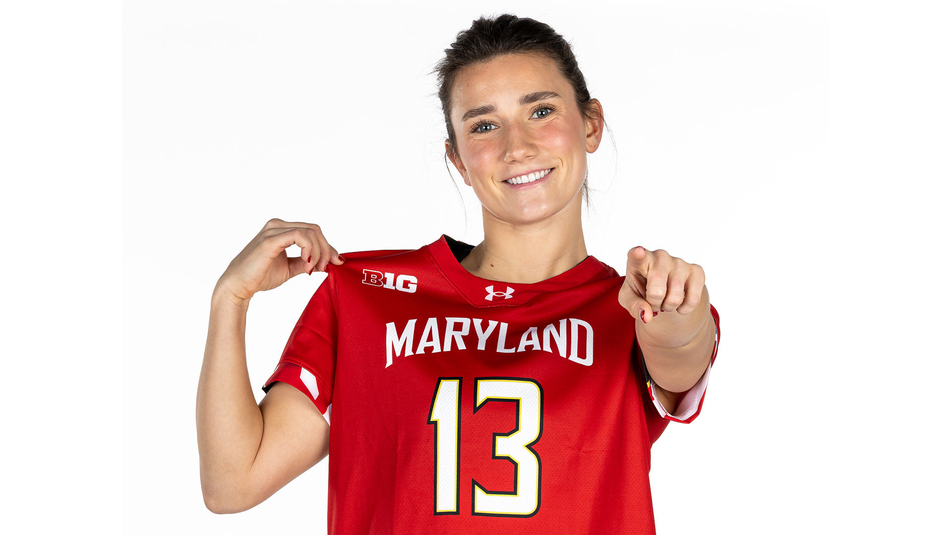 #13 Mae Marshall women's lacrosse posed white backdrop 