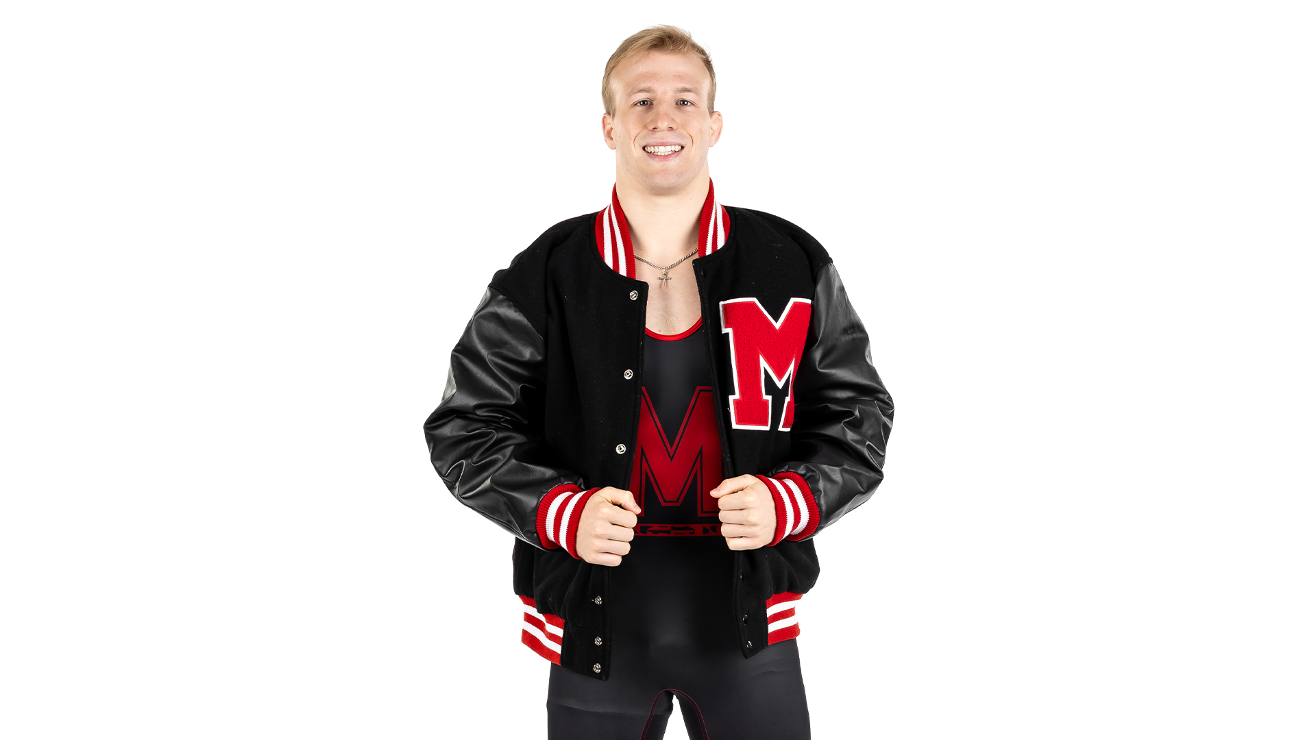 Braxton Brown poses against white backdrop in a varsity Jacket 
