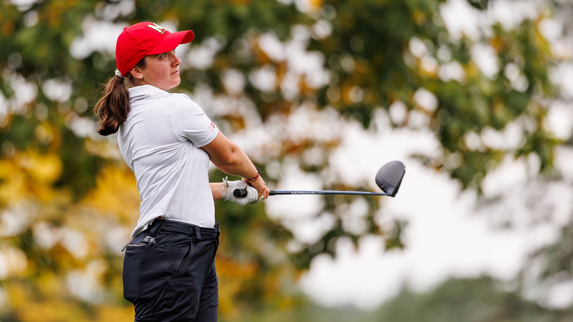 Anna Pillard tees off at the Nittany Lion Invitational