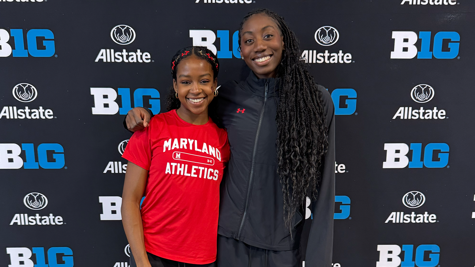 Maya Valmon and Tolu Akinduro pose after competing at the Big Ten Championships