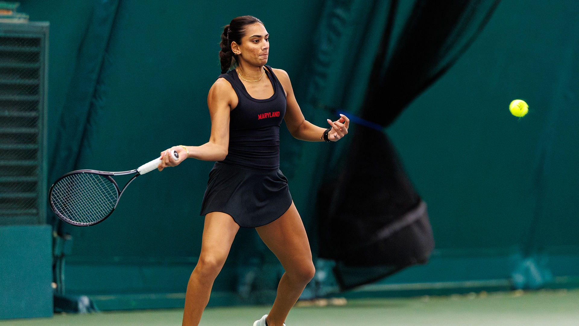 Diya Challa striking a ball versus JMU