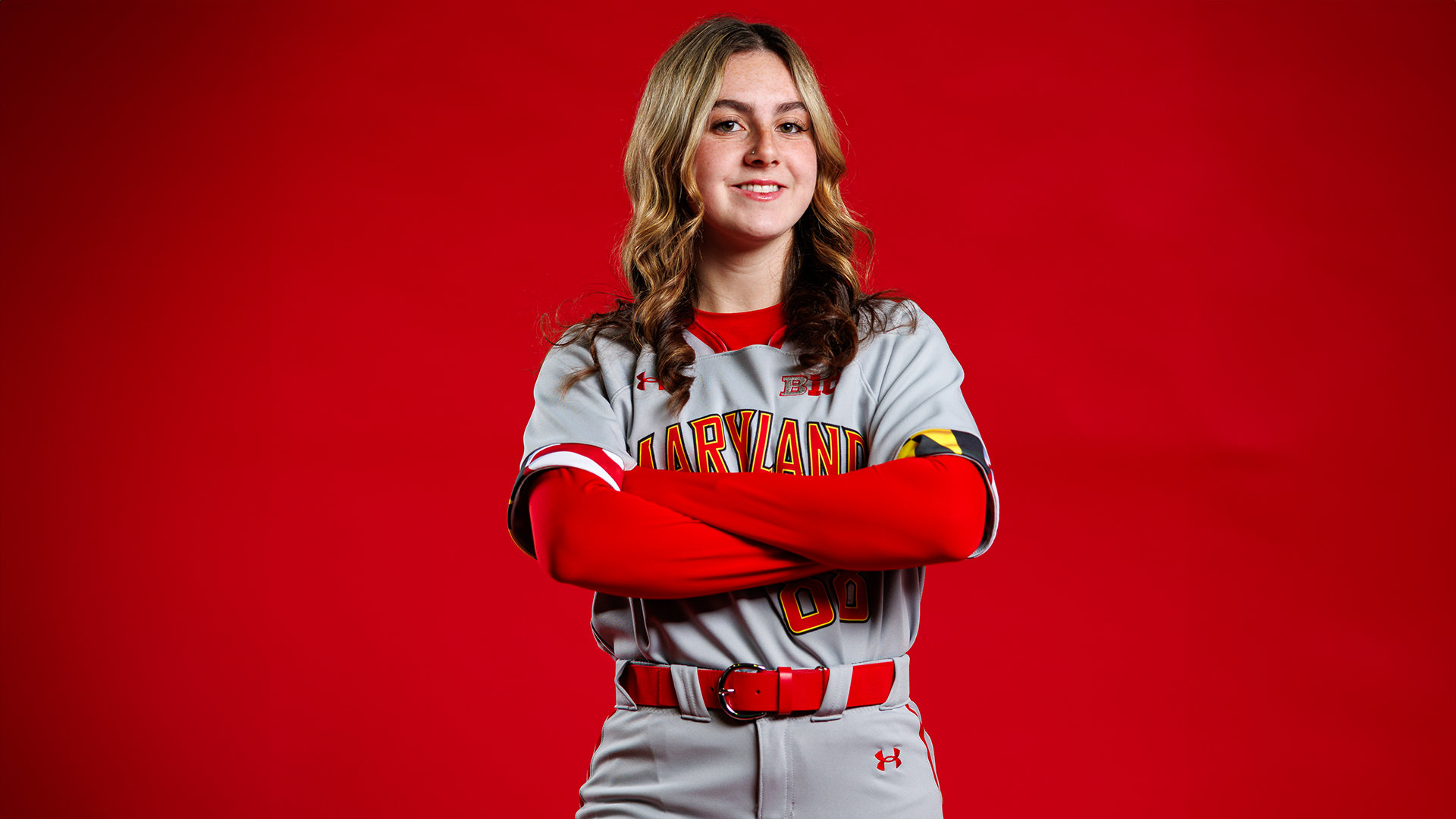 Caitlin olensky red background posed photo