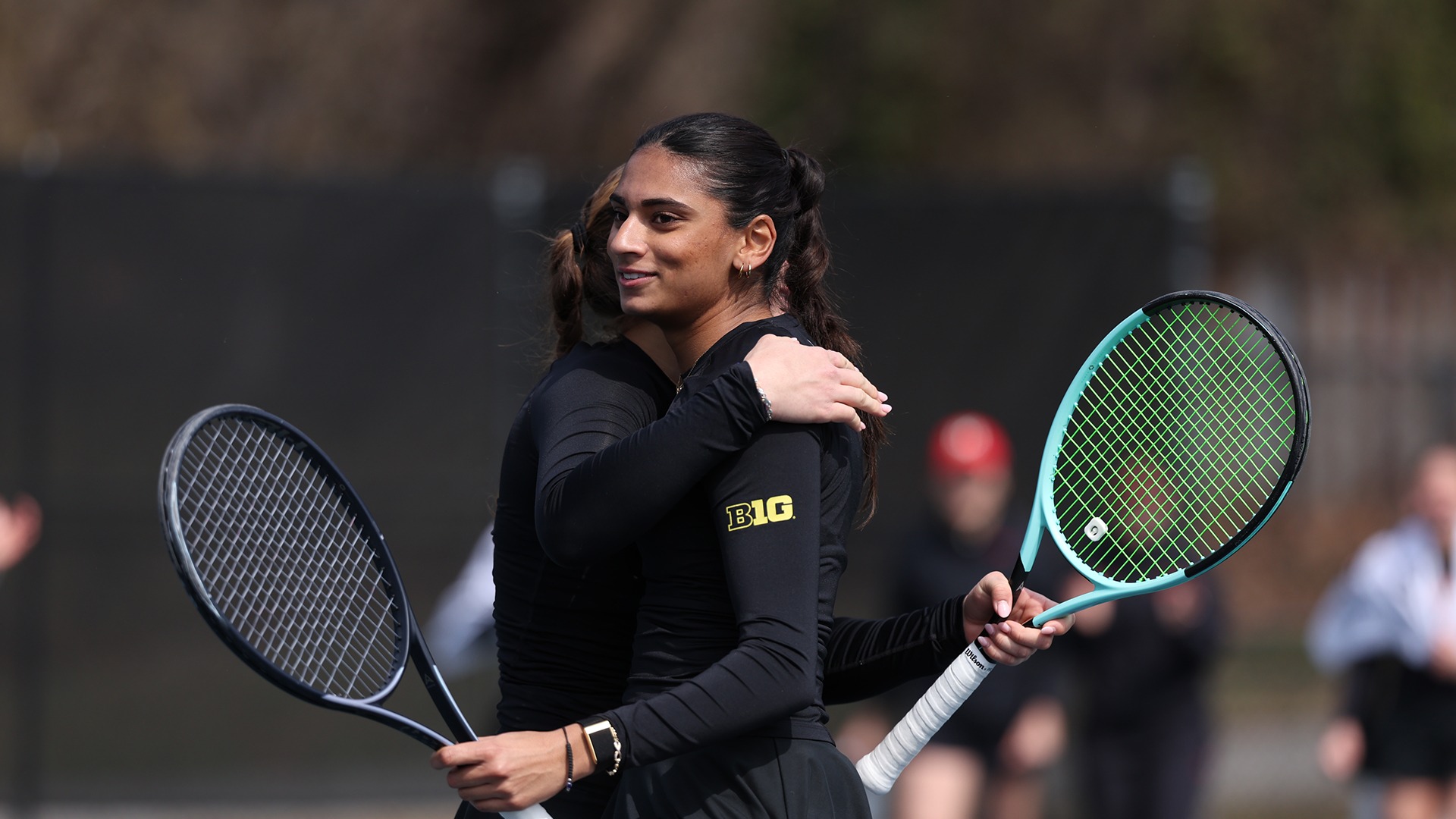 Diya Challa and Aida Eissa hugging it out after winning a thriller doubles match.