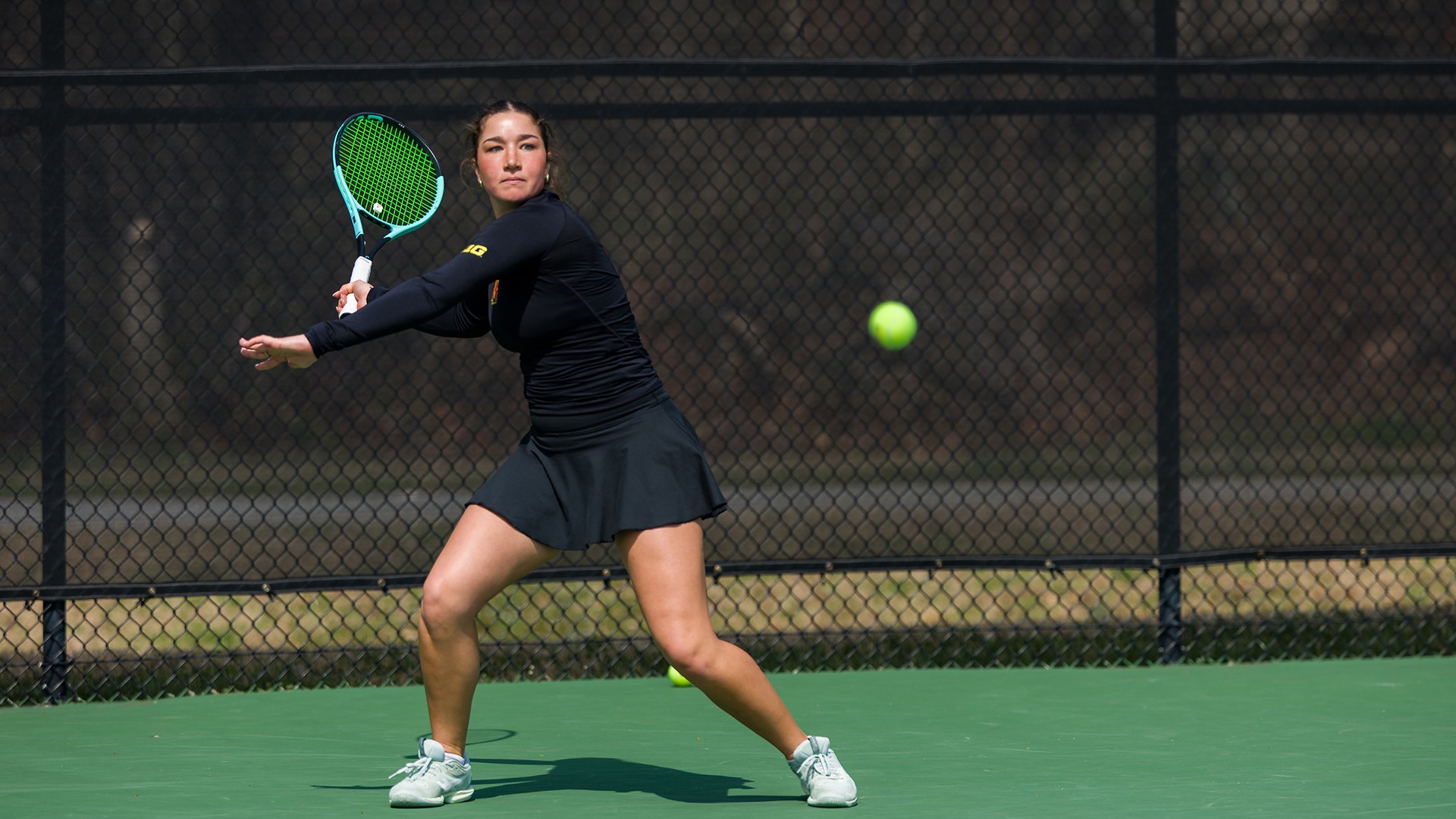 Aida Eissa striking a ball against Rutgers