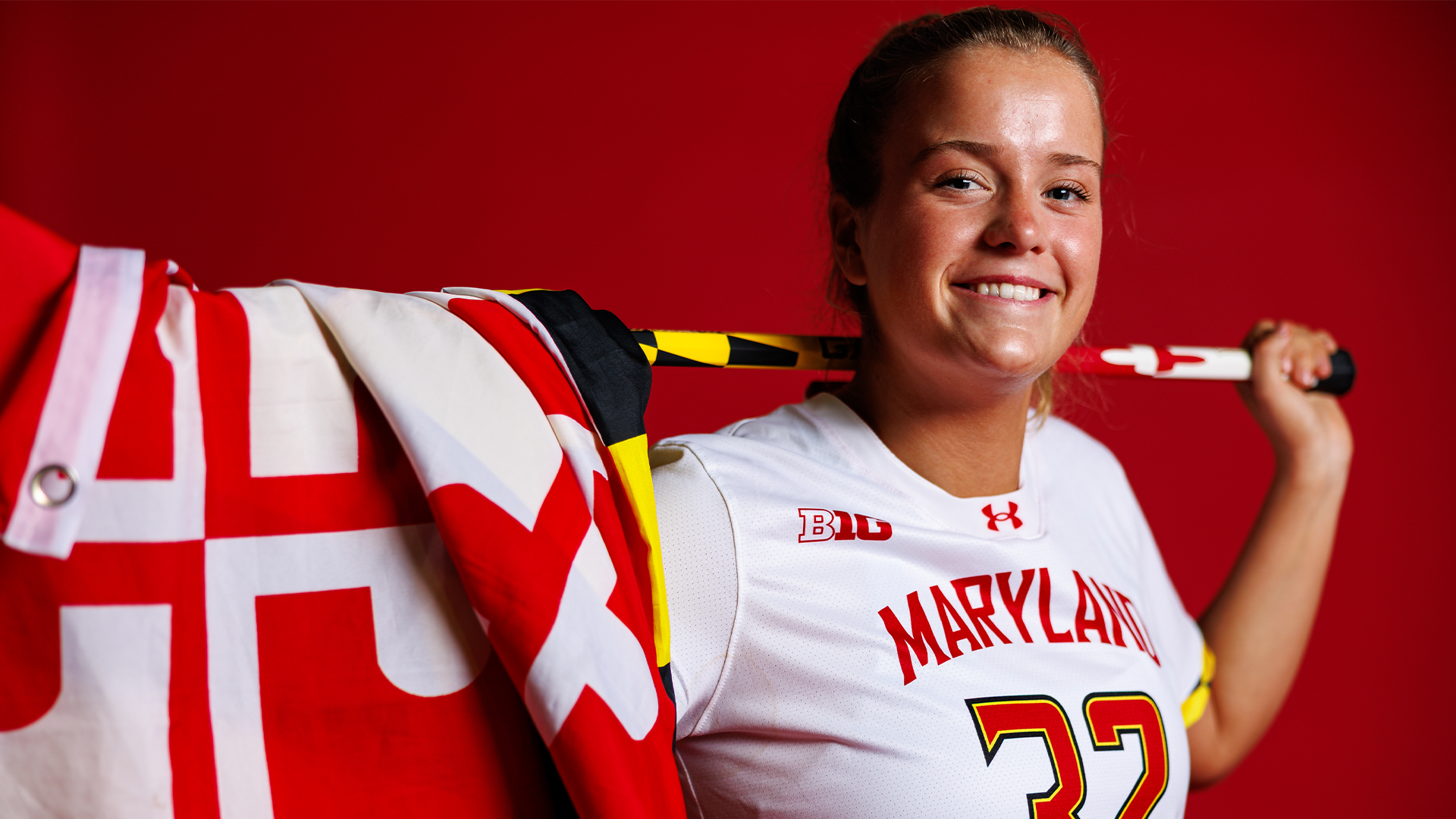 Catie Holmes posed red backdrop content day