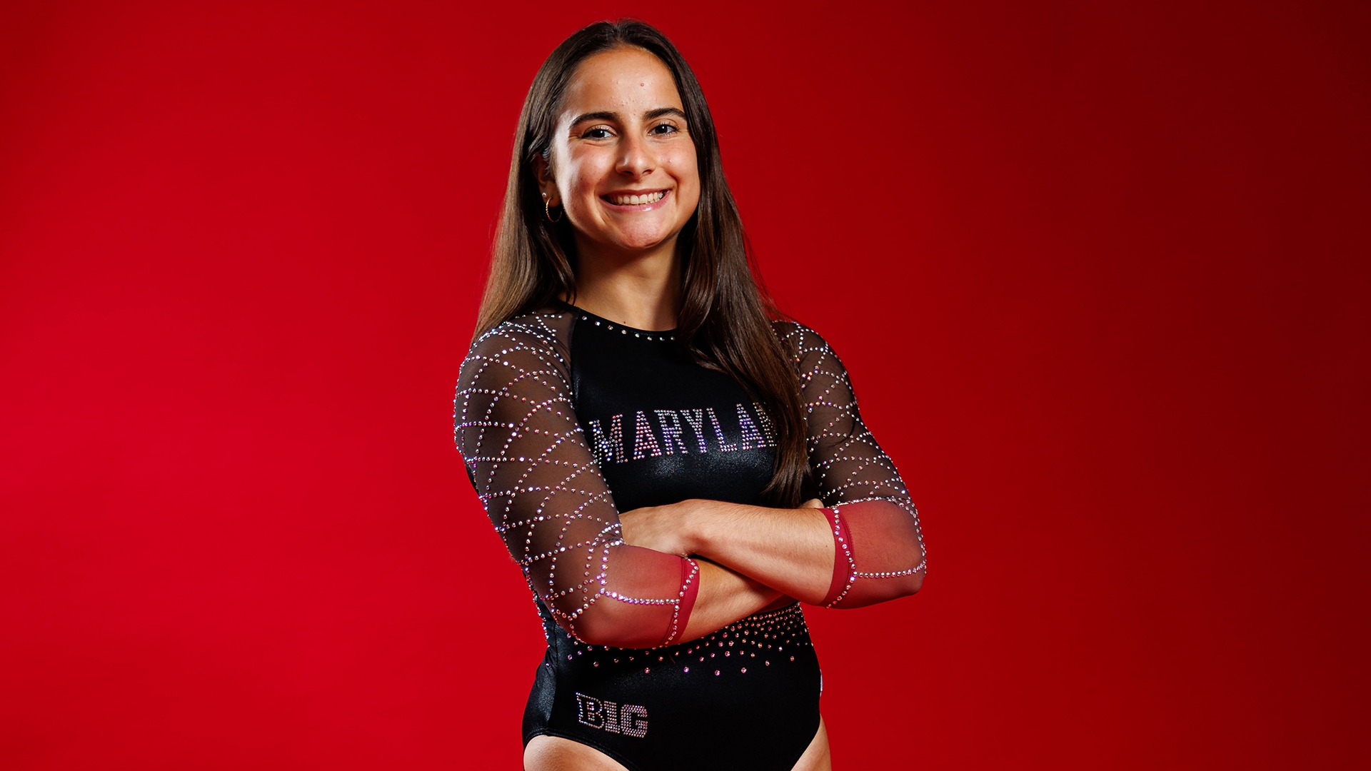 Emily Defrees Posed Red Background