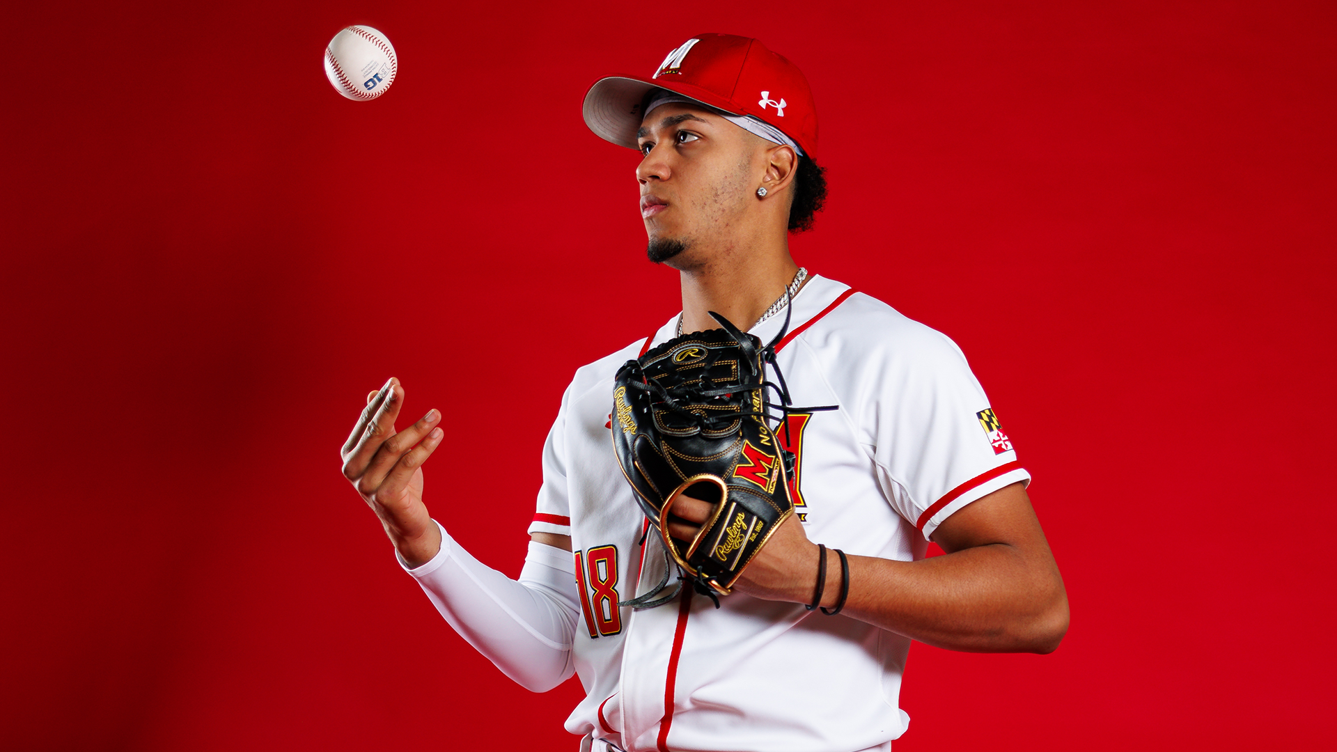 Cristofer Cespedes Story Cover Photo throwing a ball to himself in front of red background