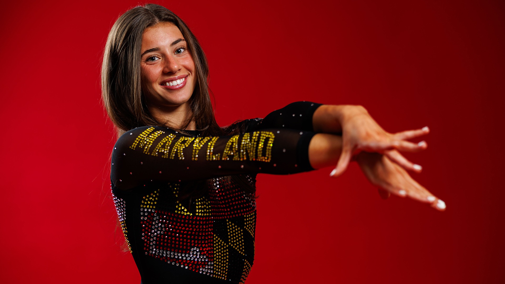 Maddie Komoroski Posed Red Background