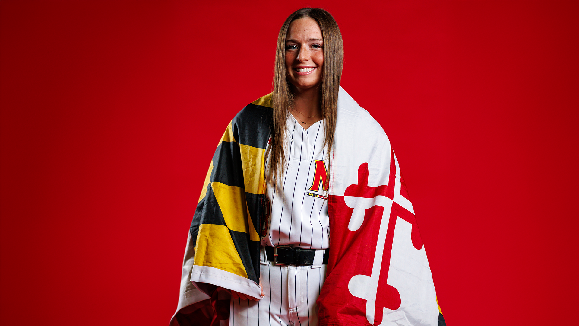 Gracie Solarz red background posed picture