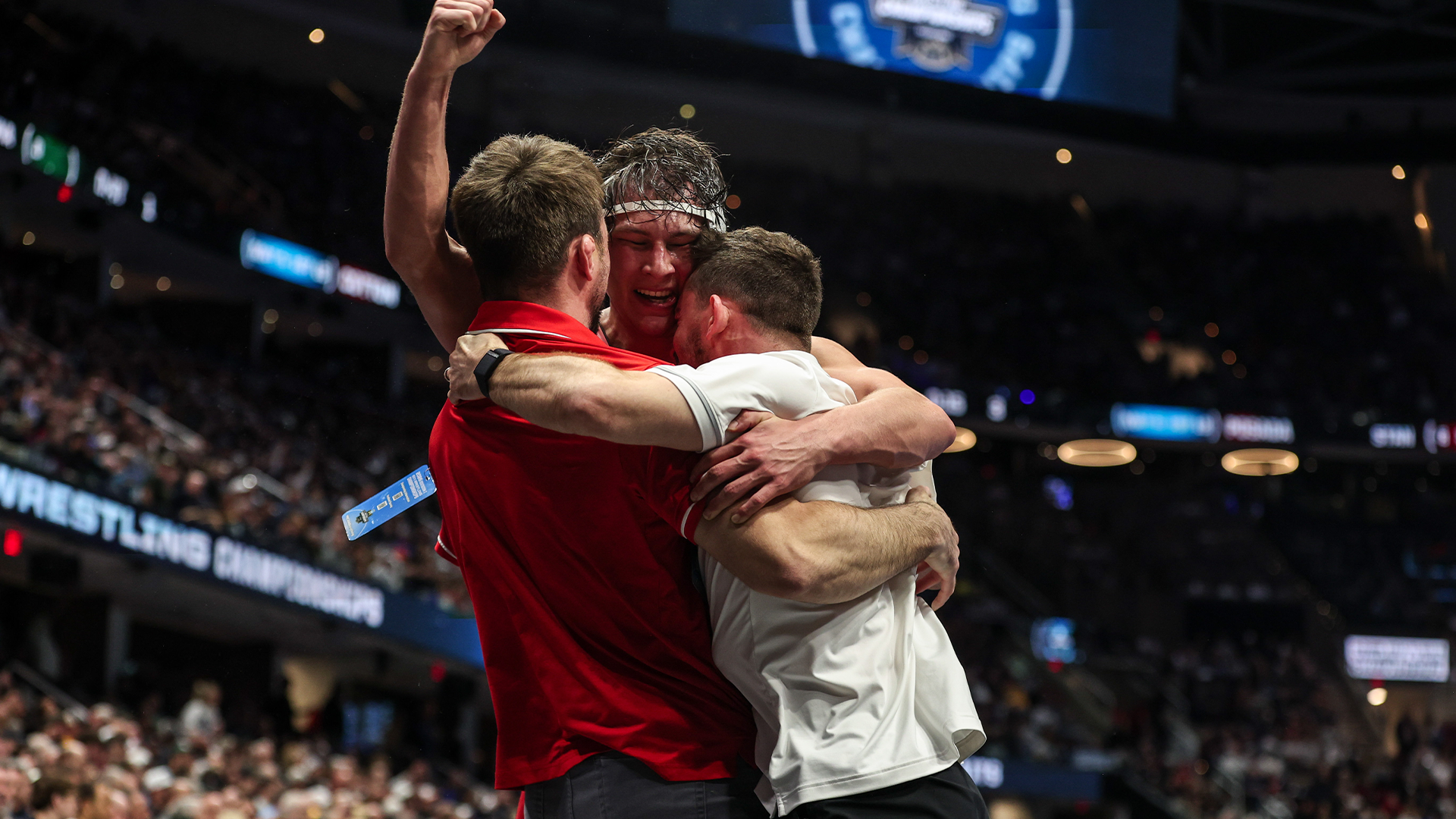 NCAA Championships Branson John Embraces his coaches after becoming an all american