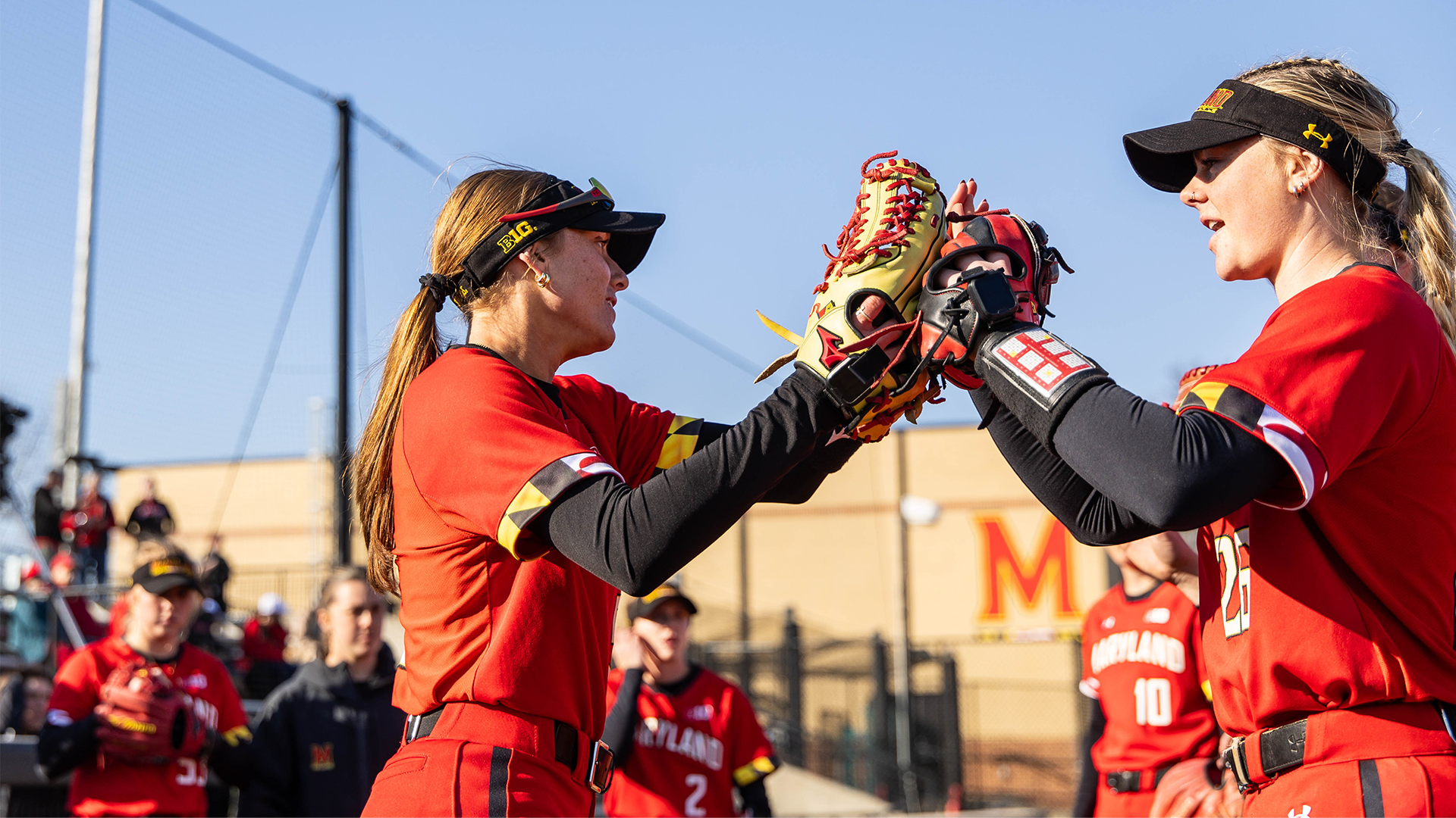 Caitlyn and Sammi high fiving pregame