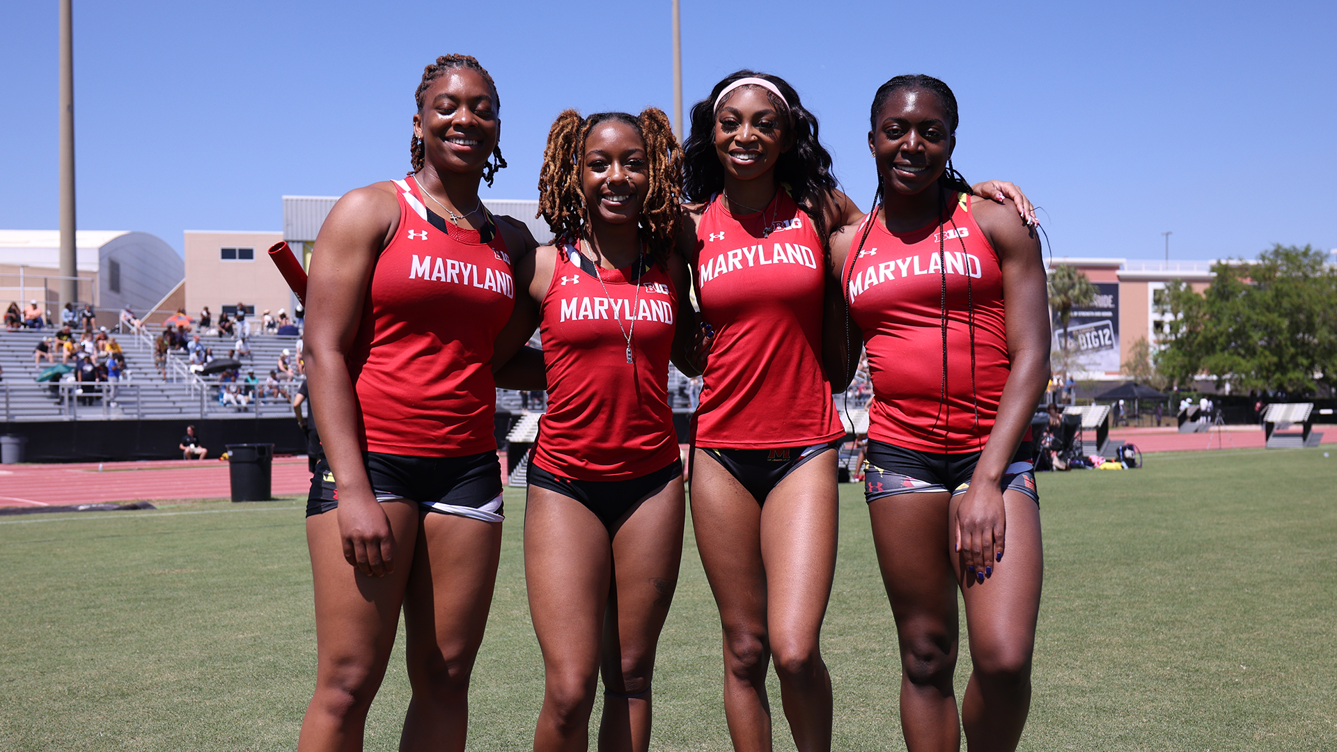 Naaema Robinson, Armanie Coleman, Jasmine Davids, and Victoria Teasley pose after posting school record in the 4x100 meters at UCF