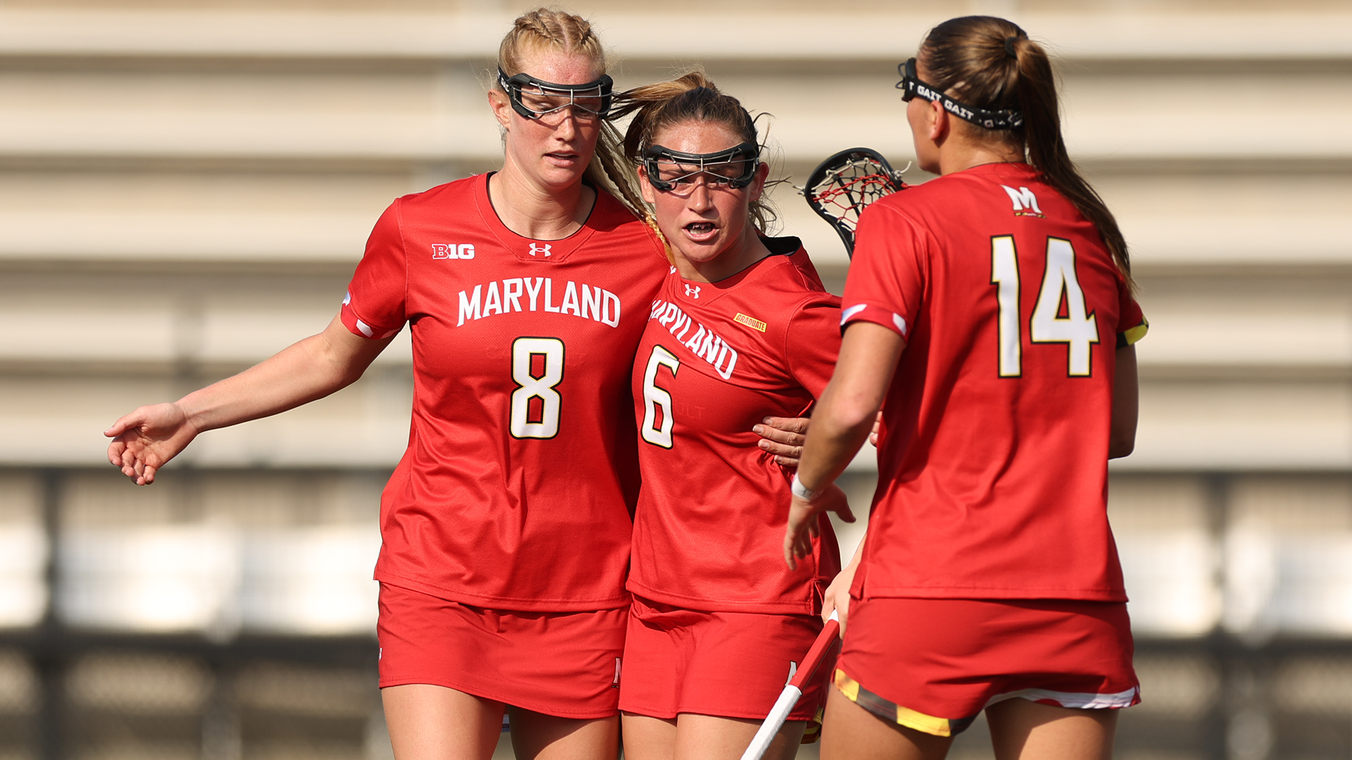 Lauren LaPointe, Keeley Block, and Kori Edmondson Celebrate a Goal Against Johns Hopkins