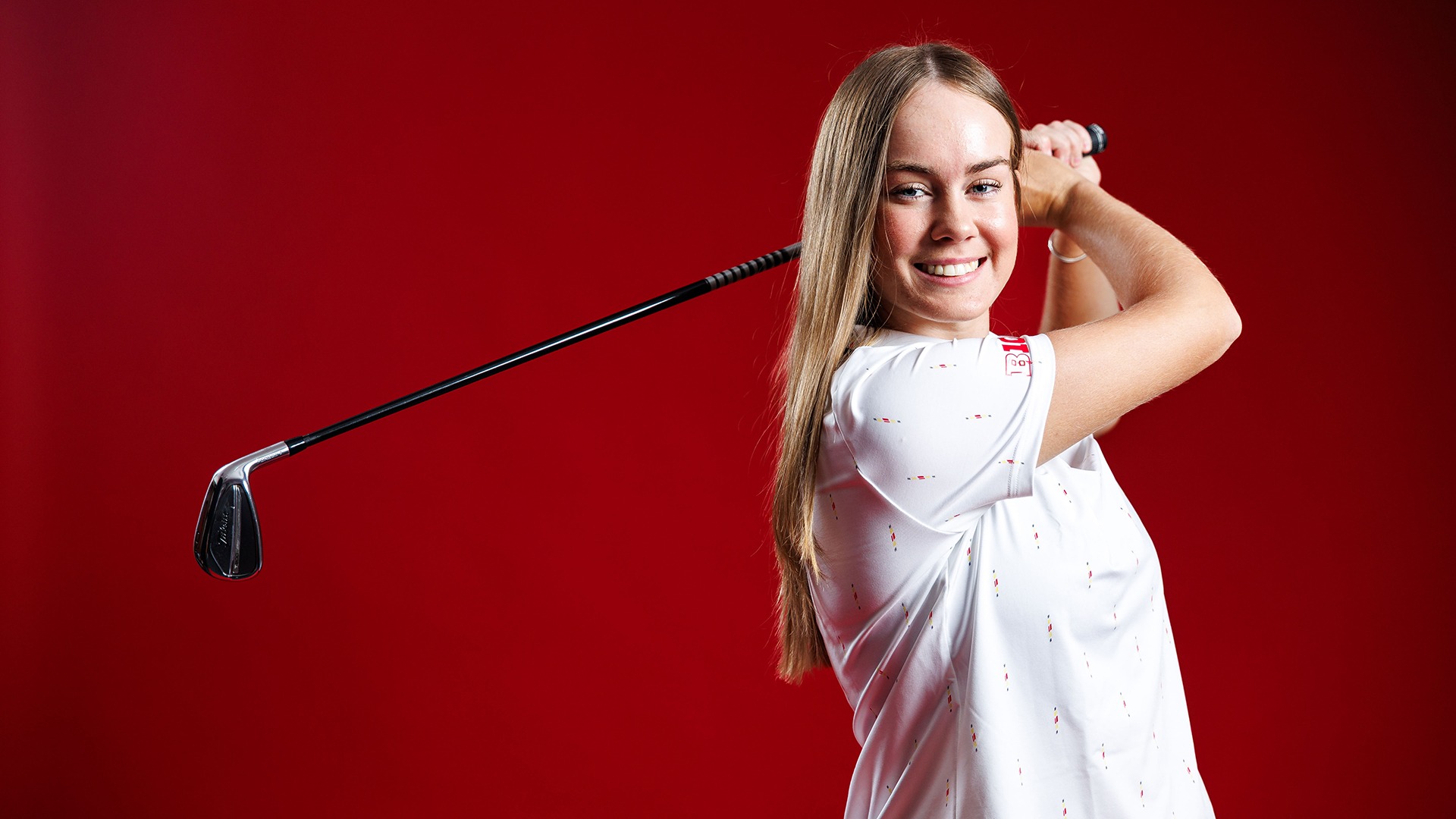 Emily McKee posed red background