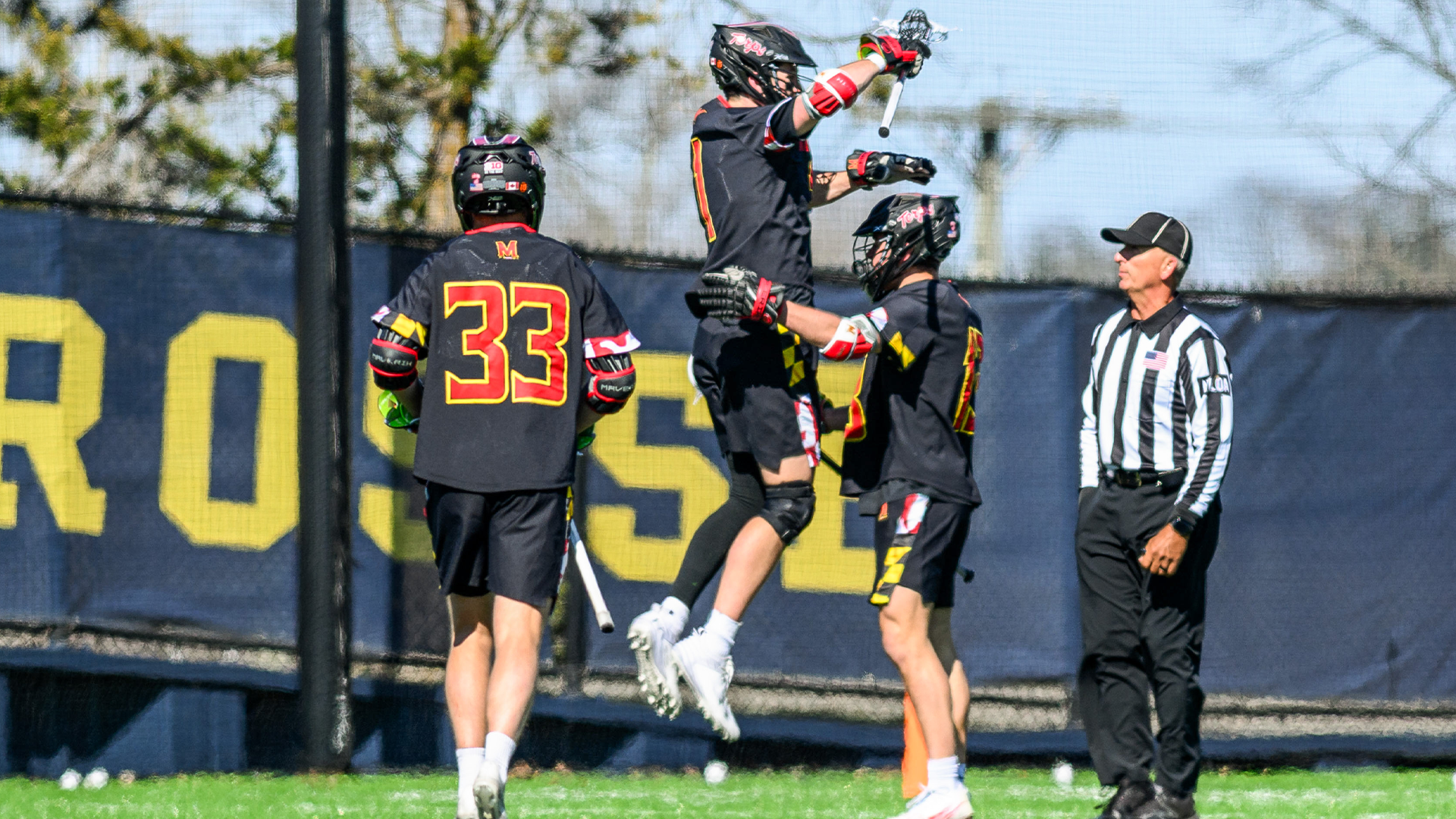 Eric Spanos Celebrates with Teammates after Michigan win