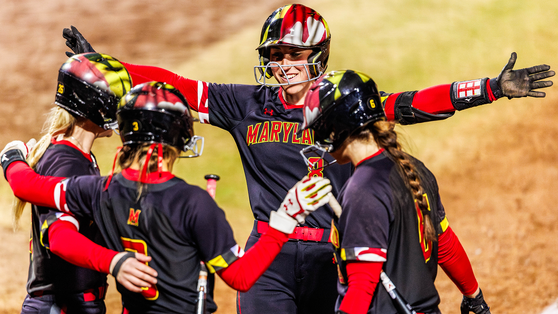 Mariah celebrating with teammates after hitting home run