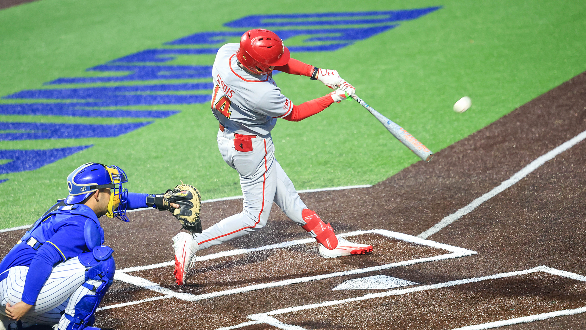 Jackson Sirois Hits a Ball in a Game Against Delaware