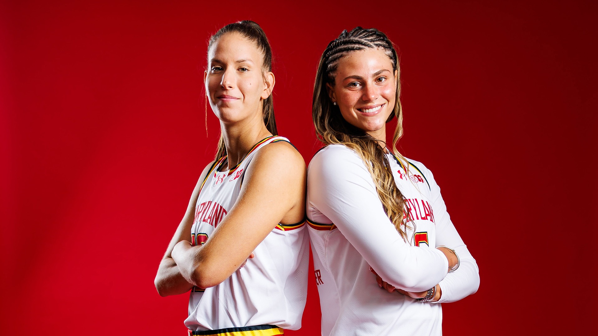 Yarden Garzon and Saylor Poffenbarger posed shot white uniforms