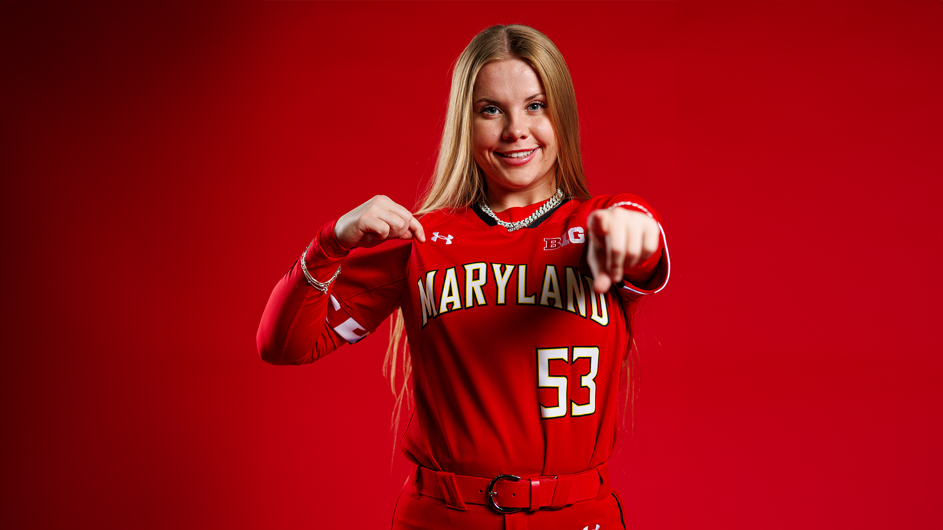 Sage Rodmyre red background posed photo