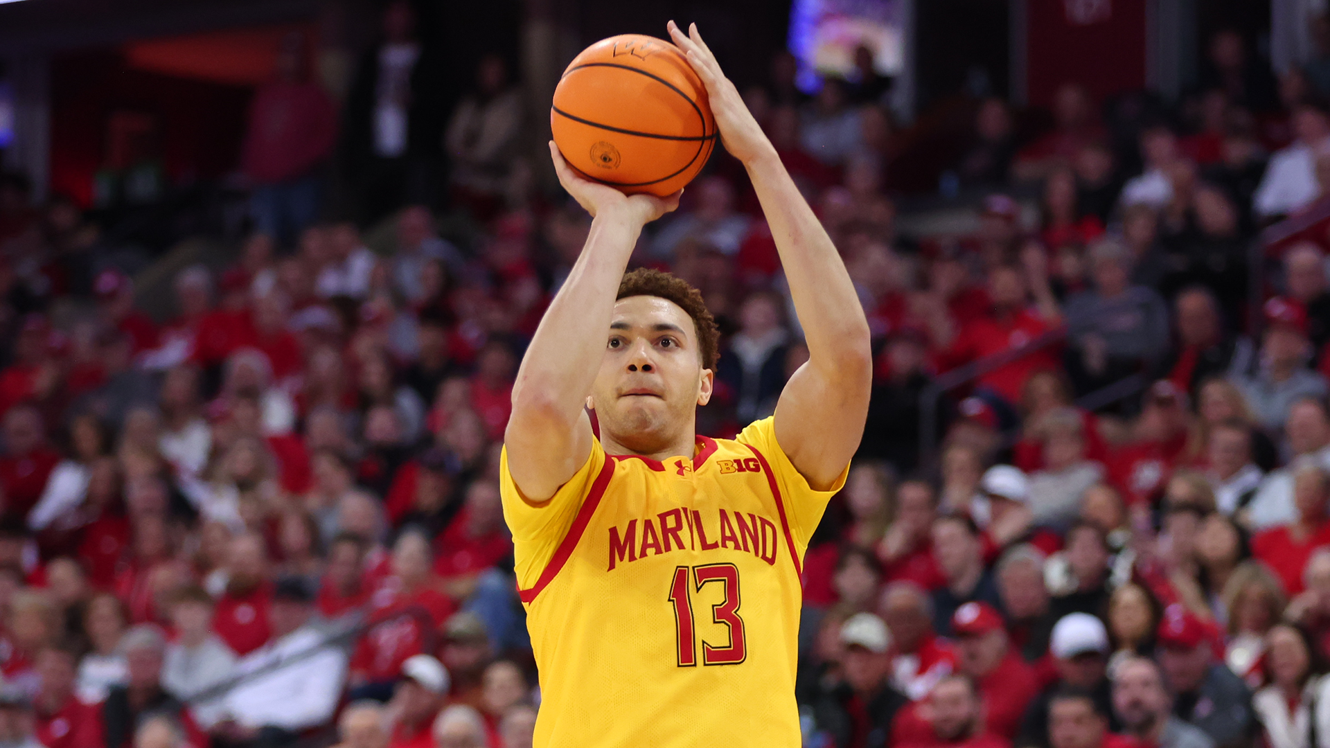 Elijah Saunders Shoots a Three-Point Shot Against Wisconsin