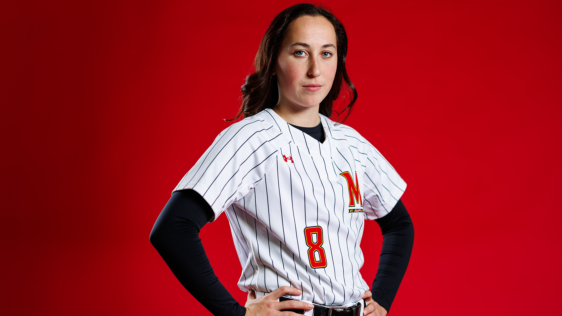 Mariah Penta red background posed shot