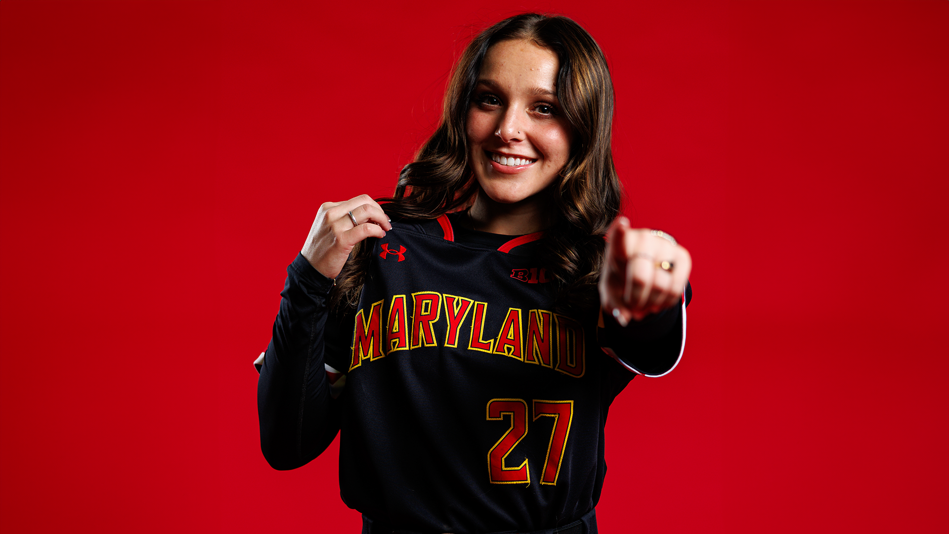 Logan Turner red background posed action photo