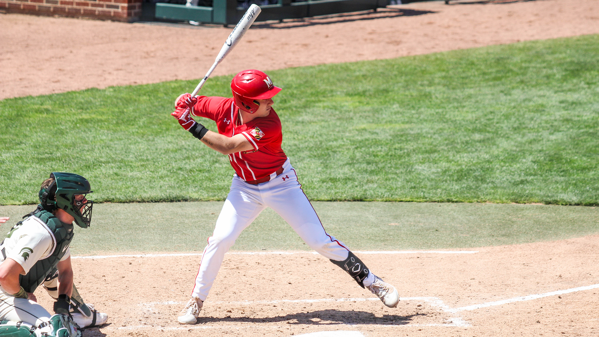 Ty Kaunas hits against Michigan State