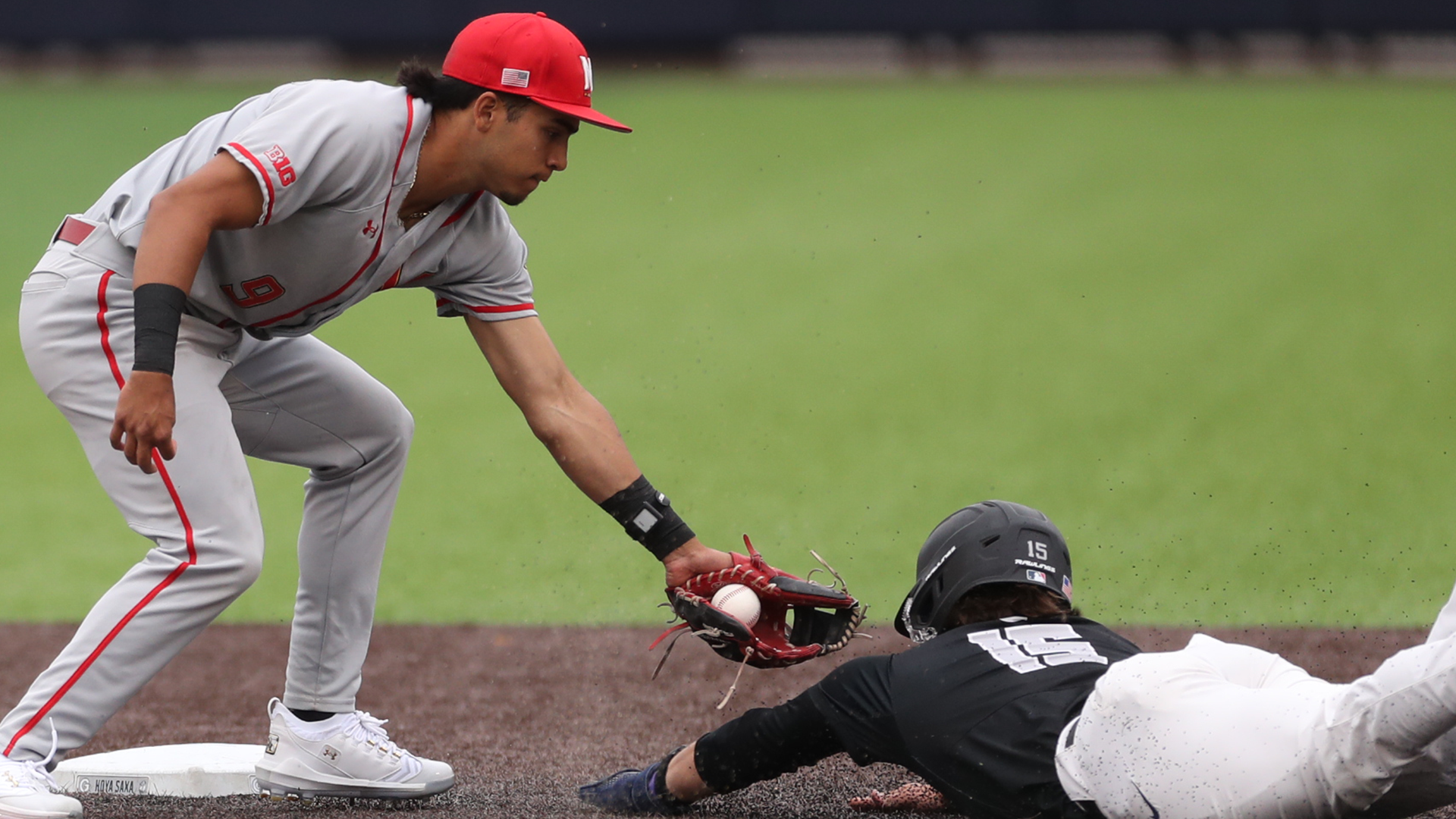 David Mendez tags a runner out as he tries to steal second in a game against Georgetown