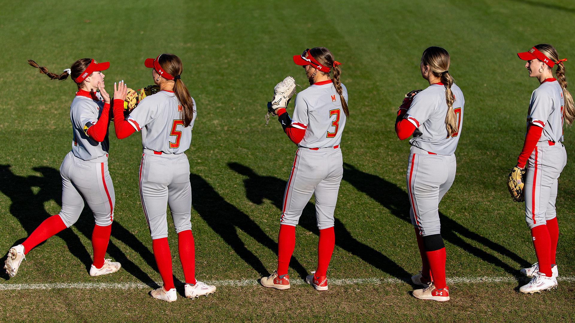 Maryland Works a High-Five Line Ahead of a Game