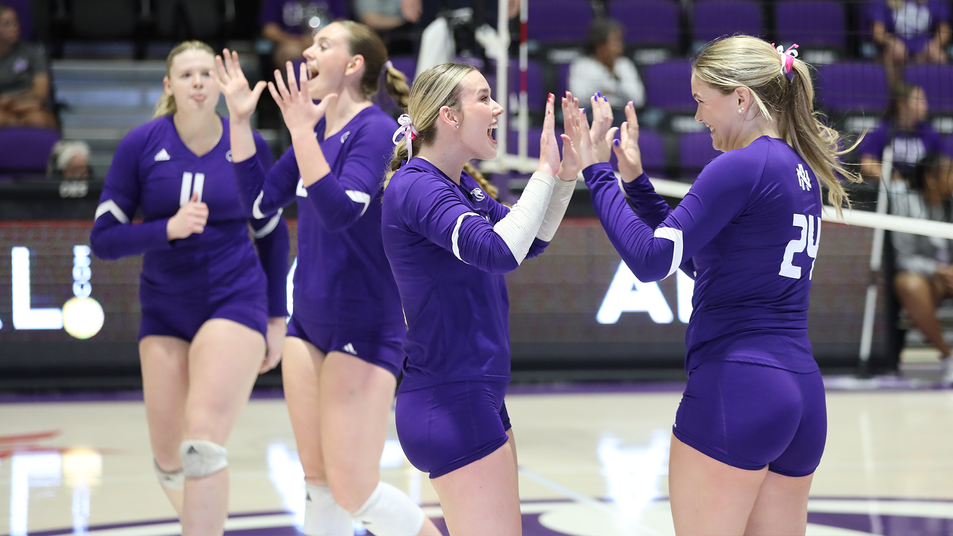 Team celebrating a point against Lipscomb on September 28, 2025