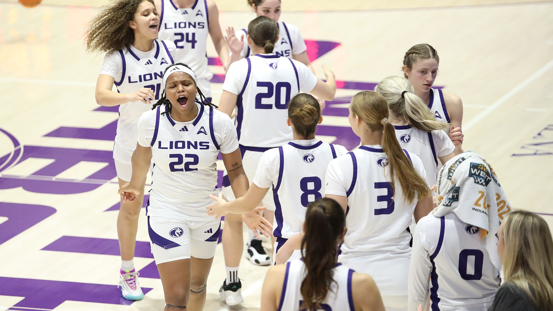 Team celebration against Bellarmine on January 10, 2026
