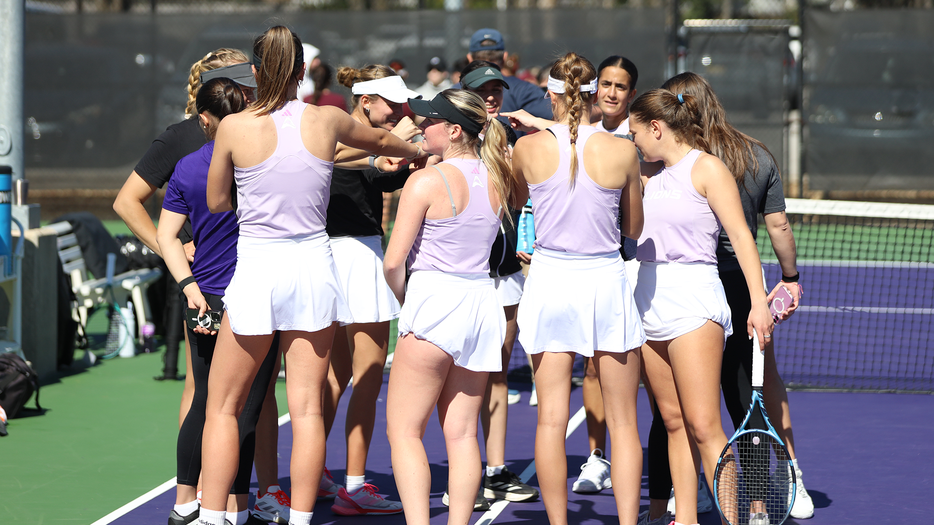 Women's Tennis team huddle vs. EKU on February 27, 2026