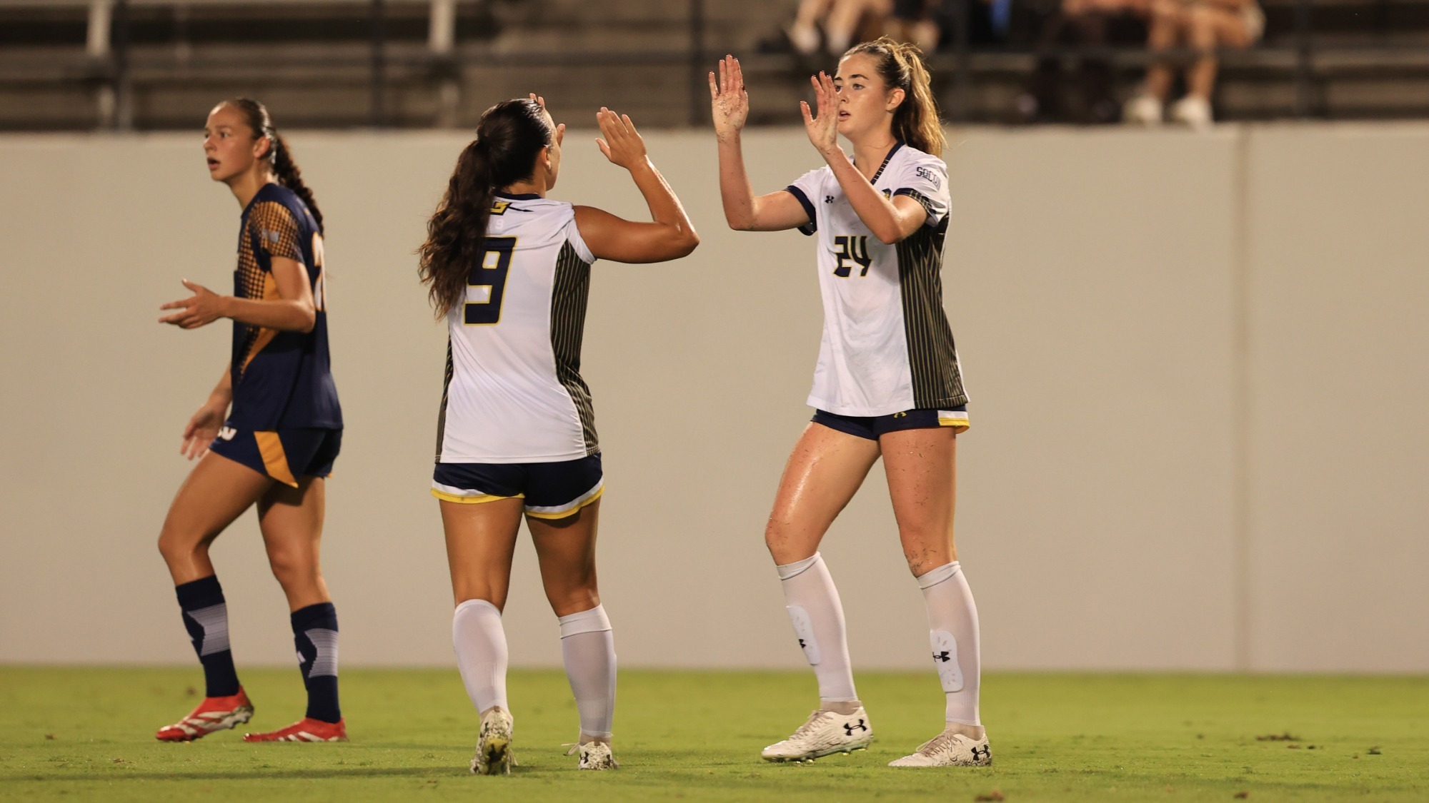 Women's Soccer high five