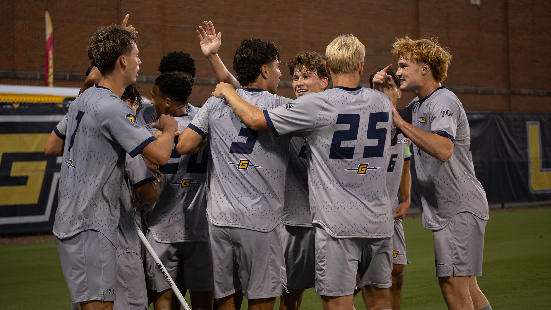 Men's Soccer celebrates after a goal against West Virginia