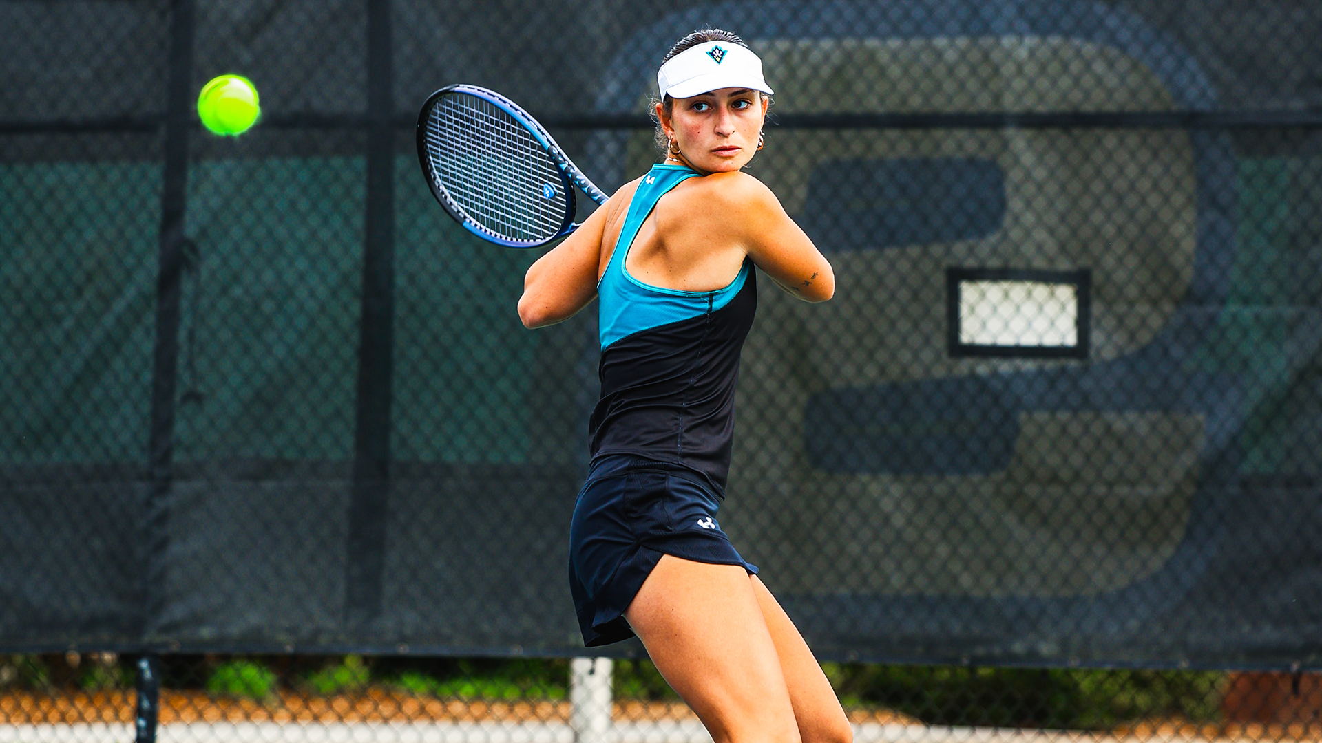 Eda Arli returns a volley against W&M