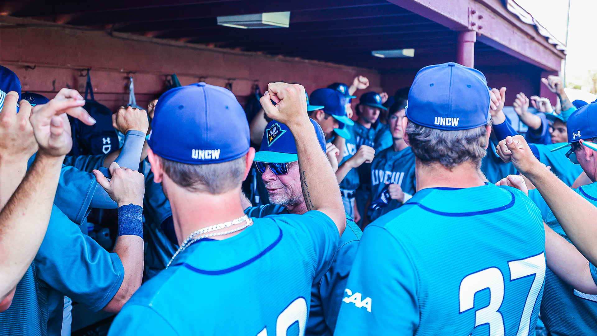 Team huddles after a loss at Charleston