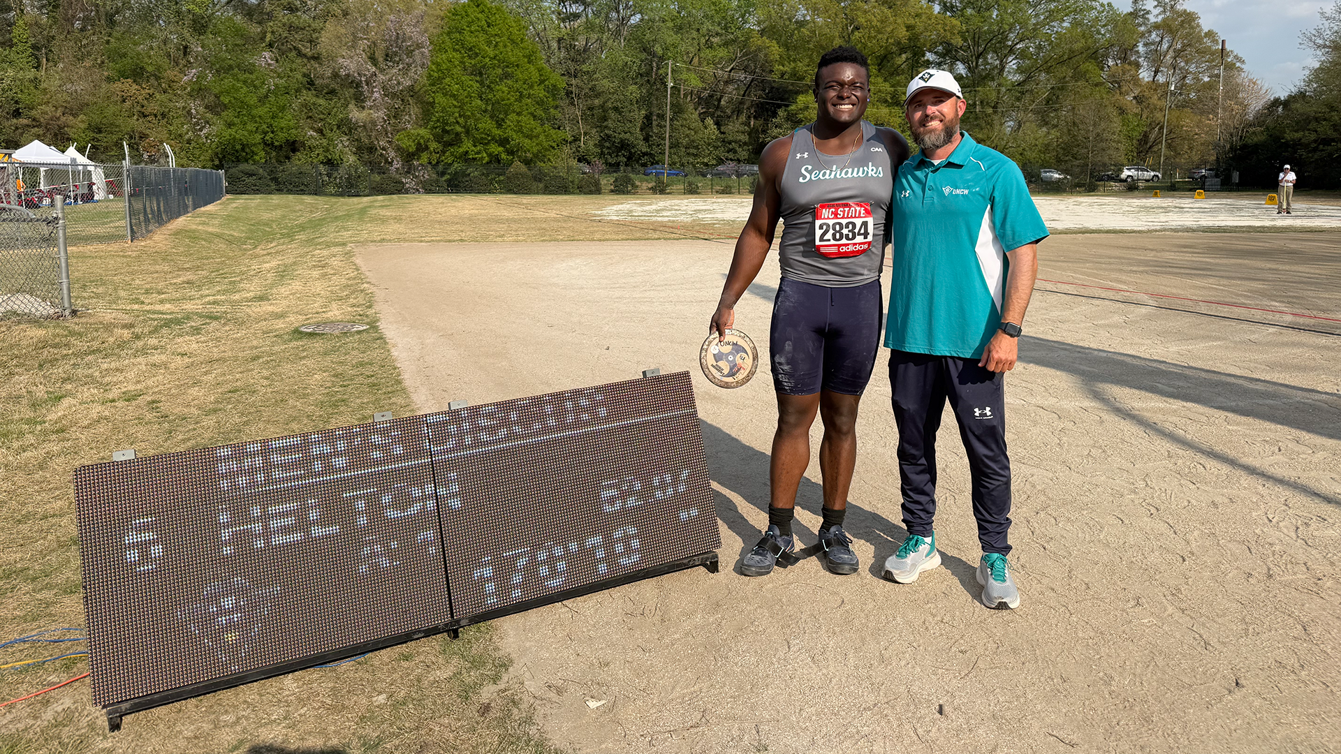 Helton breaks dicus mark at Raleigh