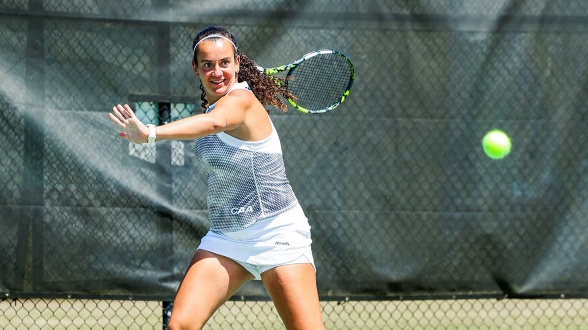 Gomez with a return volley on senior day